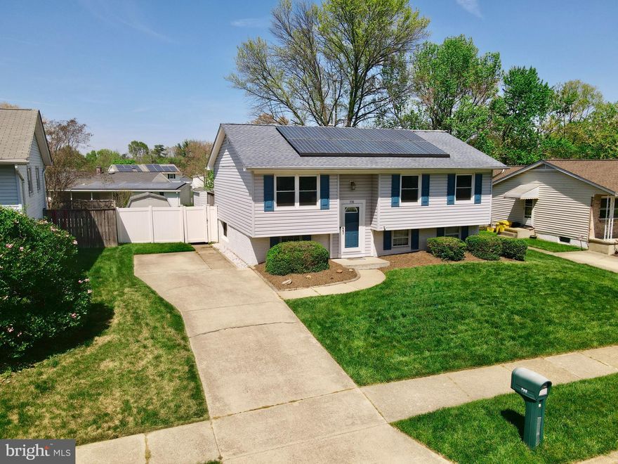 **Check out the Video Tour** Welcome to this beautifully maintained traditional home, nestled on a picturesque tree-lined street in the sought-after Valleywood community—and best of all, no waiting required to make it yours!  From the moment you step into the stately foyer, you’re greeted with elegance and warmth. Take the cascading staircase to the open-concept main level, ideal for entertaining. At the heart of the home is the newly remodeled kitchen, a true showstopper featuring premium cabinetry, upgraded stainless steel appliances, gorgeous countertops, and a large peninsula—all perfectly situated to overlook the dining area and backyard deck.  The dining room showcases a contemporary chandelier, rich hardwood floors, and a seamless flow into the light-filled living room with large windows, ceiling fan, and more beautiful hardwood flooring.  Down the hallway, you’ll find three generously sized bedrooms, including the private owner's suite with hardwood floors, a ceiling fan, and ample closet space. The additional bedrooms also offer hardwood flooring and ceiling fans—ideal for family, guests, or a home office. 
Descend to the expansive lower level where a secluded recreation room, full bathroom, and large utility/laundry room await. With new flooring throughout and abundant storage space, this level is perfect for relaxing, working, or entertaining.  Step outside to your private outdoor oasis, complete with a deck strung with lights, overlooking a fenced-in backyard with professional landscaping, a large shed, and room for endless possibilities. The front porch, surrounded by manicured greenery, adds even more charm and curb appeal.  This home is packed with notable upgrades, including: Newly remodeled kitchen,  Updated windows, Architectural shingle roof, Newer vinyl siding, Upgraded HVAC system, Fresh paint throughout, 
French drain system in lower level, Vinyl privacy fencing, Solar panel system for improved energy efficiency.  Enjoy convenient access to top-rated shopping, dining, and recreational options. Located minutes from major commuting routes (97, 32, 50, 295, 95) and central to Annapolis, Baltimore, Washington DC, Northern VA, NSA, Fort Meade, MARC Train, and more.  ✨ Don’t miss your chance to own this move-in ready gem with a brand new kitchen and so much more. Schedule your private tour today!