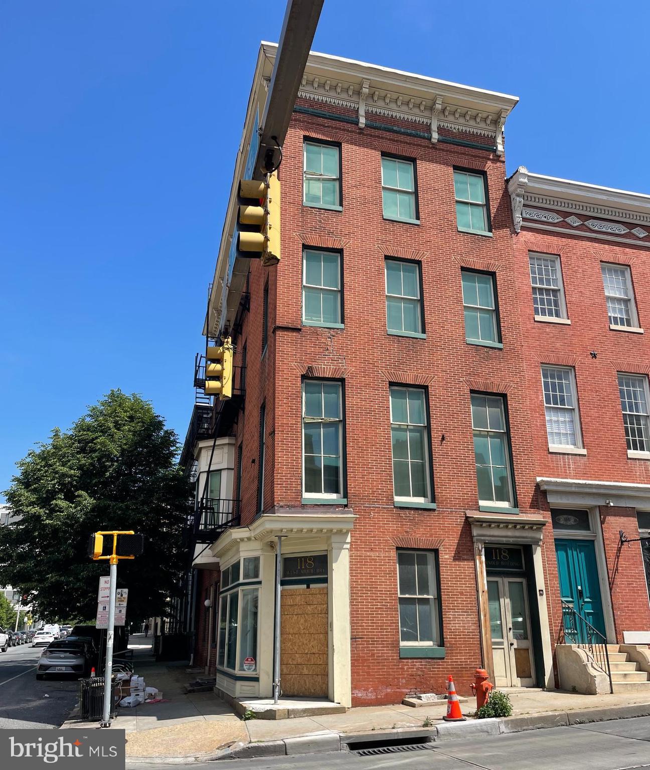 Four-story corner property in need of refurbishment located at the intersection of Mulberry Street and Park Avenue in Baltimore's downtown neighborhood. Sale is subject to receivership terms. Before closing, the City will need to see proper documentation of the Buyer's ability to rehabilitate. The property offers impressive square footage and allows versatile potential, having been used previously as both a law office and art studios.The C5-HT zoning allows for flexible division of the space, accommodating either mixed residential or commercial use. The interior is full of possibility, featuring south-facing rooms with tall ceilings and abundant natural light. Built-in bookcases, a remnant of the property's law office days, add a unique charm. Currently, the configuration is ideal for studios or offices with a street level gallery. Its prime location offers close proximity to the central Pratt Library, the Bromo Arts and Entertainment District, the Mt Vernon Marketplace, and Baltimore's Chinatown.