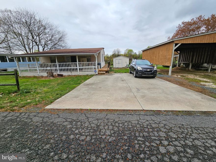 The year of the trailer is estimated. Large two lot location with three bedrooms found in Indian Acres Campground. Gated Community is limited to 150 days a year no more than 100 consecutive days (not a full time residence). So much to do such as swimming, boating, fishing, or relaxing. Spacious trailer with addition as well as a large outdoor deck in the front and rear of the structure to relax and entertain.  Must become a member to purchase the property and annual dues. We look forward to welcoming you to the community.