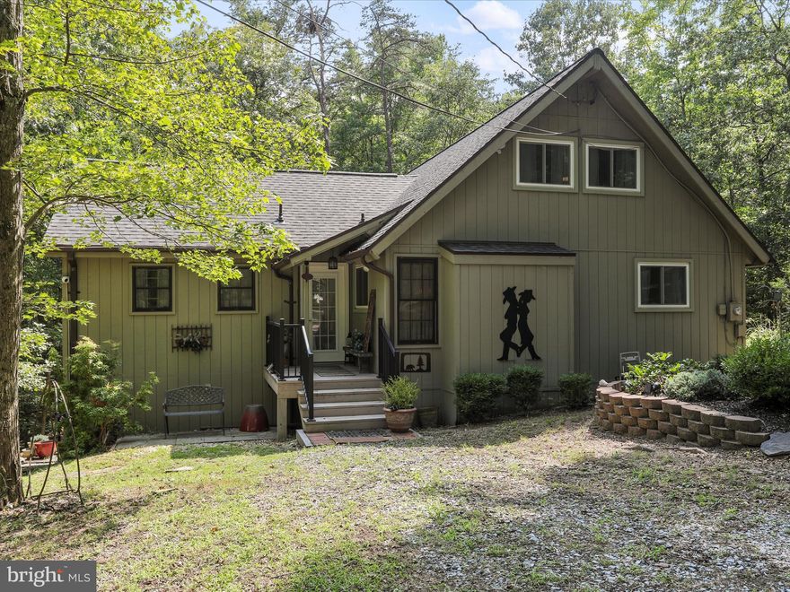This Elmwood-style home offers a harmonious blend of comfort and style with its 3 bedrooms, 2 full baths, and a versatile loft that could serve as a 4th bedroom. Upon entry, you'll find a convenient laundry room and a full bath just down the hall to the left. The primary bedroom, bathed in natural light, features a vaulted ceiling, hardwood flooring, and a spacious clothes closet.
The great room is a centerpiece of the home, boasting a wood-burning fireplace with a custom wood mantle and a striking fixed window wall with remote-controlled blinds. A ceiling fan, also controlled by remote, adds to the room's functionality. The great room seamlessly connects to the outdoor spaces, with sliding glass doors leading to both a large open deck and a screened porch, perfect for enjoying the outdoors in comfort. 
The kitchen is a modern chef's delight, complete with granite countertops and a custom-built pantry equipped with pull-out drawers. Towards the back of the home, you'll find two guest bedrooms, each featuring hardwood flooring and ample closet space. The guest bath is conveniently located down the same hallway, ensuring privacy and ease for visitors.
With all-new doors, windows, and a new roof, this home is move-in ready and designed for both relaxation and entertainment.  Class B Woods Club Membership is available for transfer with a $3150 initiation  fee.