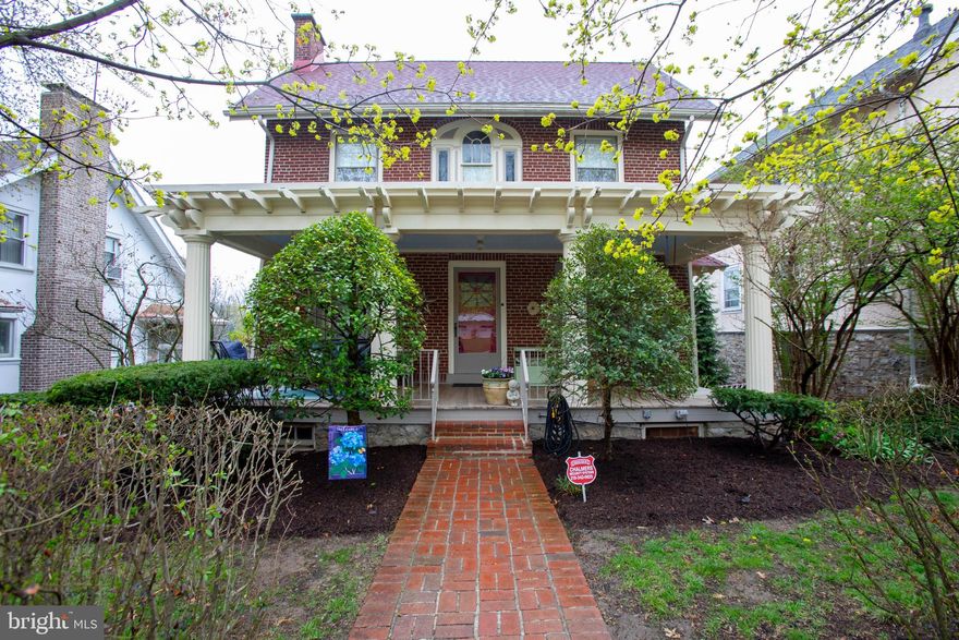 Welcome to this beautifully maintained 1910 home, offering a perfect blend of historic charm and modern updates. Located in a desirable neighborhood, this 4-bedroom, 1.5-bathroom home features an inviting layout with warm character throughout. The first thing you will notice is the gorgeous Mahogany covered front porch.  Step inside to discover an updated kitchen with quartz countertops and sleek stainless steel appliances The cozy living room boasts a wood-burning fireplace, perfect for chilly evenings. The main level also features a dining room with antique chandelier, half bath,  stacked laundry and access to a wonderful covered rear porch.The home’s electrical system has been fully updated with brand-new wiring and a 200-amp service for peace of mind.Upstairs, you’ll find four bedrooms, one of which is a convenient walk-through space—ideal for a nursery, office, or sitting room. The full bathroom has timeless, amazing original tile work. There is also a huge walk up, unfinished attic. Outdoor enthusiasts will love the fantastic covered deck, which overlooks a beautifully landscaped backyard. The current owner has cultivated gorgeous perennial gardens creating a private oasis. The home also features a new gas boiler for efficient heating and 2022 gas water heater and a roof that was replaced in approximately 2014.