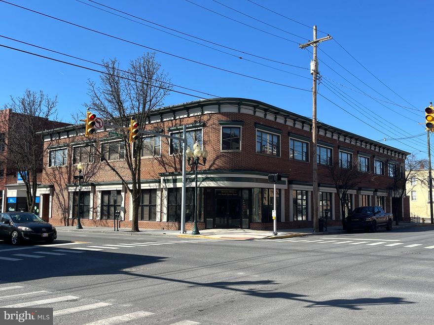 Located in the heart of downtown Martinsburg, this iconic landmark building offers a unique opportunity for investors and business owners alike. Featuring over 18,000 square feet on the 1st and 2nd level with an elevator serving all three levels (1st, 2nd and basement), the building is currently utilized as office space but offers flexible potential for a variety of uses. The first floor boasts a reception area, 4 conference rooms, 2 bathrooms and 13 offices. The second floor has 21 offices, 3 bathrooms and a large open floor area. The lower level is about 9,000 square feet and  primarily unfinished. In addition to the main building, the property includes a 1000 square foot ancillary structure that is currently under lease, providing an additional revenue stream. With its central location and historic charm, this property is a must-see for anyone looking to invest in downtown Martinsburg.