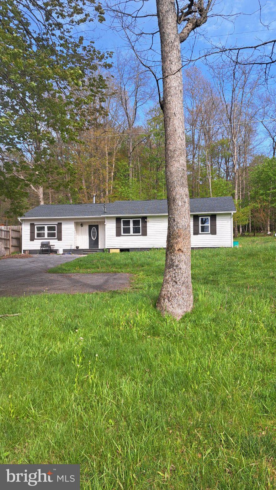 This charming 3-bedroom, 1-bathroom ranch-style home in the desirable Oakland Sang Run Rd area near the Youghiogheny River offers a blend of modern upgrades and classic appeal. Recently renovated in 2022, the interior features an open floor plan with luxury vinyl tile flooring, built-ins, and a gourmet kitchen equipped with stainless steel appliances and upgraded countertops. Enjoy the convenience of main floor laundry and double-pane windows for energy efficiency. Set on a generous 4.88-acre lot, the exterior includes an outbuilding and a wood/metal shed, perfect for storage or hobbies. The property provides ample driveway parking and a serene outdoor space for relaxation. Located in a vibrant community, residents benefit from nearby parks, excellent schools, and convenient public services. This home is ideal for those seeking a peaceful retreat with easy access to local amenities. Don't miss the opportunity to make this property your own!