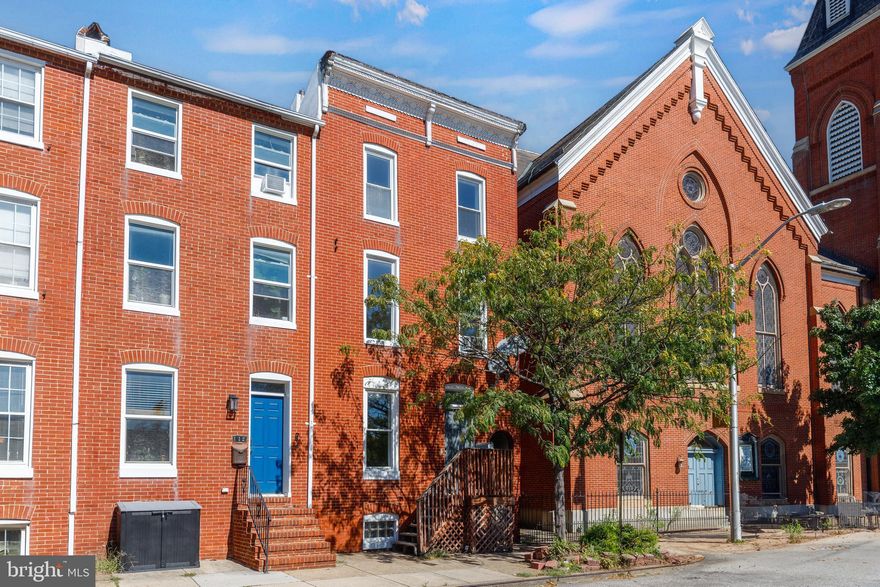 Please note, photos have been virtually staged! Discover the charm of this 4-bedroom, 2-bathroom end-of-row Federal Hill townhome—a historic brick beauty now enhanced with modern updates throughout. Step inside to find updated LVP flooring on the main level, brand new carpeting in the bedrooms, and fresh paint that gives the home a bright, refreshed feel. Enjoy peace of mind with brand new windows installed throughout the home. The kitchen is fully equipped with stainless steel appliances, new countertops, and stylish accent finishes that elevate the space.
Upstairs, the bedrooms and bathrooms are spread across two levels for added privacy. The first upper level features two spacious bedrooms and two full bathrooms—each featuring new showers and updated vanities. The second upper level offers two additional large bedrooms with ample closet space.

The basement has been waterproofed with a new drainage system and sump pump, offering extra utility or storage space. Outside, enjoy a fenced-in patio—perfect for relaxing or entertaining. Just a short walk to Cross Street Market, local parks, and the stadiums, with quick access to major highways for an easy commute. This updated Federal Hill gem offers the perfect mix of historic character and modern comfort—don’t miss it!