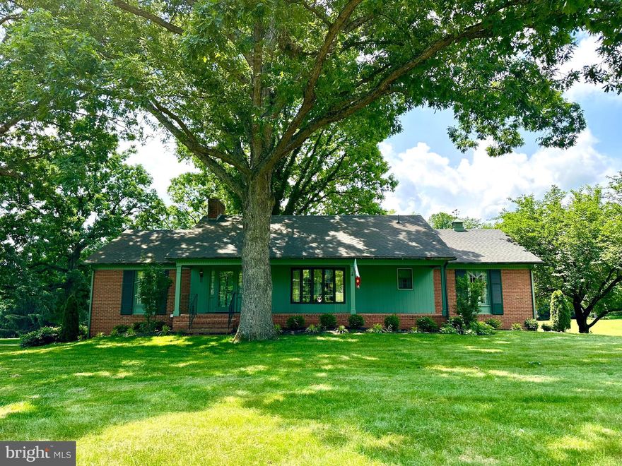 Discover the beauty and charm of this custom-built, one-owner brick Ranch home situated on 1.26 pristine acres on Hopewell Road! The pride of ownership shows throughout this entire property, and you must see it to appreciate all that custom details that are in this home. Wide plank solid wood floors, victorian-style door locks with skeleton keys, crown molding, chair rail, wainscoting & wall moldings, built-ins, window cornices, copper gutters, and the list goes on! Along the main level you'll find a generously sized Living Room with a bay window, a Dining Room with a pantry closet and a bay window, and a cozy Family Room with built-in bookcases and a brick wood-burning fireplace. The eat-in Kitchen walks-out to a nice screened-in porch, a perfect setting to enjoy the outdoors and watch the sunsets. The spacious Primary Bedroom features a recently remodeled Primary bathroom (with a large shower & granite countertops) and a walk-in closet. Two additional bedrooms and a full hall bathroom finish off the main level. And now...on to the lower level...wait until you see the Recreation Room that is the perfect setting for gatherings! Unique wood walls, custom pendant light fixtures, an attractive stone fireplace (gas), and an elegant wet bar (completely with a sink and mini-stove).  If more space is needed, you can open up the doors and enjoy the brick patio outdoors. The lower level also includes a recently remodeled full bathroom, a bonus room (previously used as an office) with built-in cabinetry, washer, dryer, laundry tub, hot water heater & water conditioning system), plus the 2-car attached garage. And let's not forget about the additional 1-car detached garage with electric, a phone hook up, and a plug-in wall heater. No detail was spared in this charming home, and you'll love the beautiful 1.26 acre landscaped lot that backs to trees. PLUS the fantastic LOCATION - so close to major commuter routes (I-81, Rt. 37, Rt. 7),  Clear Brook Park, Amazon, Valley Health Systems, Shenandoah University, shopping amenities and more. This one is a MUST SEE!