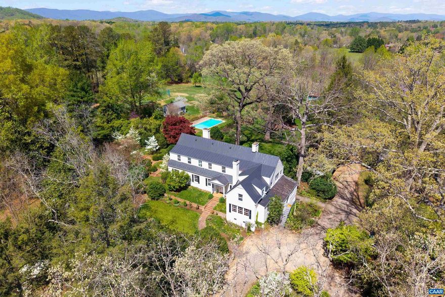 Robin Hill- An Exclusive Retreat in Ivy, Just Minutes from Charlottesville and UVA. Nestled on a magnificent 4.11-acre estate that embodies the essence of historic English homes, Robin Hill presents a rare opportunity to own a stunning brick residence in a highly sought-after location. This exceptional property blends modern luxury with timeless architectural elegance. Upon entering, you are welcomed by a grand entrance hall leading to a spacious great room, ideal for both entertaining and relaxing. The dining room, featuring a fireplace, exudes sophistication, while the updated kitchen connects seamlessly to a cozy library/media room and a sun-drenched porch, perfect for enjoying morning coffee. The upper level includes a luxurious primary suite and three additional en suite bedrooms, providing ample space for family and guests. The estate is enhanced by a refreshing pool surrounded by mature trees, a lovely blue slate patio, a guest house, a four-car garage, and a versatile barn, all contributing to its unique character. Offering an unmatched blend of elegance, comfort, and convenience in a picturesque setting, Robin Hill is not just a home; it?s a lifestyle.,Marble Counter,Fireplace in Bedroom,Fireplace in Dining Room,Fireplace in Family Room,Fireplace in Great Room,Fireplace in Master Bedroom,Fireplace in Study/Library