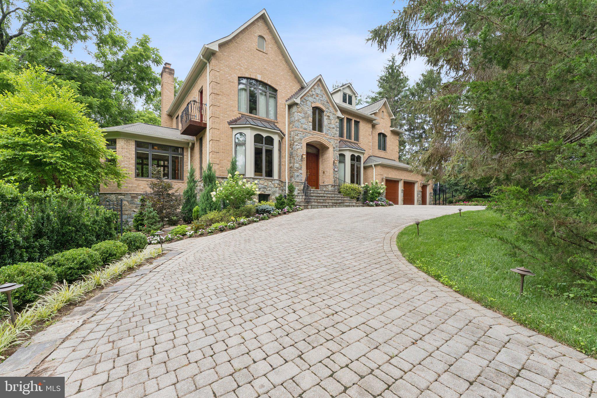 This spectacular home offers unmatched luxury, manicured grounds, and gracious living, all on a secluded drive in beautiful McLean, Virginia. Custom built in 2004, its timeless sophistication and tasteful finishes make it a perfect residence for entertaining, whether for family, friends, or business. The main floor offers an easy flow of diverse gathering spaces including a formal dining room and living room, a sparkling sunroom, a cozy family room with a fireplace, and a more private sitting room. The expansive gourmet kitchen--with appliances by Miele, Fisher & Paykel, and GE Monogram--features abundant counter space and cabinetry, plus a large eating area banked by a wall of windows that look out onto mature trees and the private pool. Off the kitchen, you will find a combined laundry and pantry that includes a second full-sized fridge and access to the 3-car garage, as well as a service entrance. Rounding out the main level of the home is a half bath and a modest bar with wine storage. Upstairs, by either the sweeping staircase in the main foyer or the backstairs off the kitchen, you will find four of the home's six bedrooms and three full bathrooms, including the beautifully appointed primary suite. This level also has a generous open space just off the backstairs that is well-suited to be a more private sitting area for the home's residents. The home's lower level provides a large recreation room which has been outfitted with an A/V projection system, the fifth bedroom, and full hall bath with a steam shower. A bonus room that conveniently connects to that hall bath aspires to be a home gym or even a dance studio. The center hall gives access to the patio, private pool, and lovely gardens. Also on this level is a county-approved ***private apartment*** with a kitchenette that is open to a combined living/dining area, a large bedroom with a walk-in closet, and private full bathroom. In the good-sized utility room, there is a second laundry and additional storage. To further help you enjoy living here, all landscaping and pool maintenance are included. If desired, the services of the homeowner's longtime housekeeper can be arranged for an additional fee.