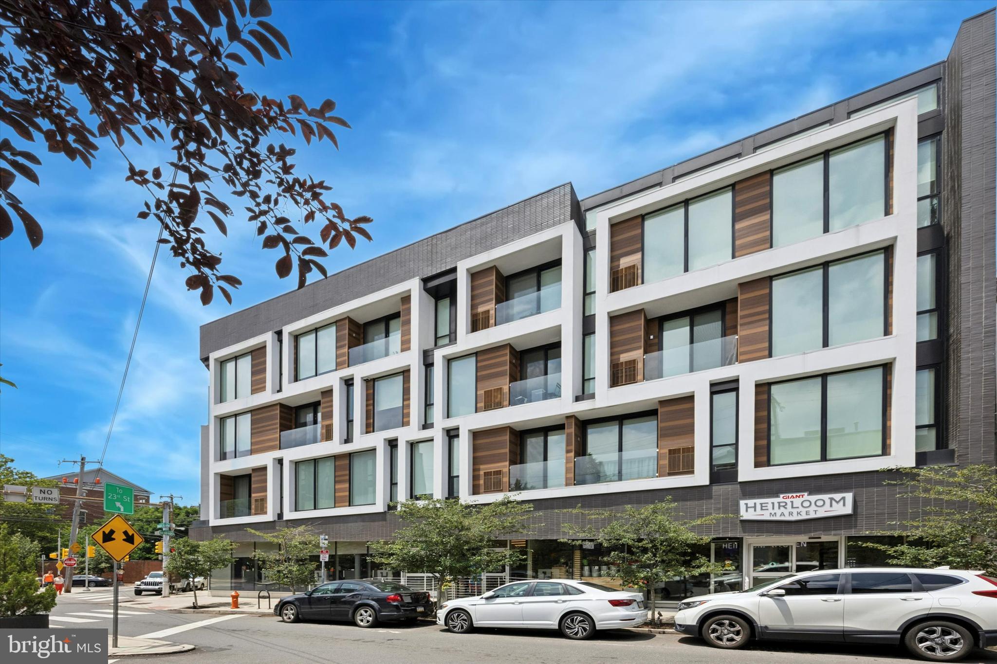 Elegant and modern condo in Bloc23! This beautifully designed building offers an unbeatable location—walk to UPenn, Center City, parks, top-rated restaurants, and shopping. The unit includes an assigned indoor parking space plus a private storage unit. Several years of ongoing tax abatement remain, and condo fees are very low. Located at the edge of Graduate Hospital and Fitler Square—two of Philadelphia’s most desirable neighborhoods!
This home features high ceilings, floor-to-ceiling windows, luxury wide plank hardwood flooring, solid wood doors, Nest thermostats, keyless entry, and USB outlets. The kitchen is equipped with soft-close cabinetry and high-end appliances including a Bertazzoni oven/cooktop, Liebherr refrigerator, and Bosch dishwasher. A range hood venting to outside adds both function and style. Bathrooms feature mosaic marble tile backsplashes and showers, with sleek floating toilets for a modern finish. Residents enjoy a common rooftop deck with stunning skyline views.