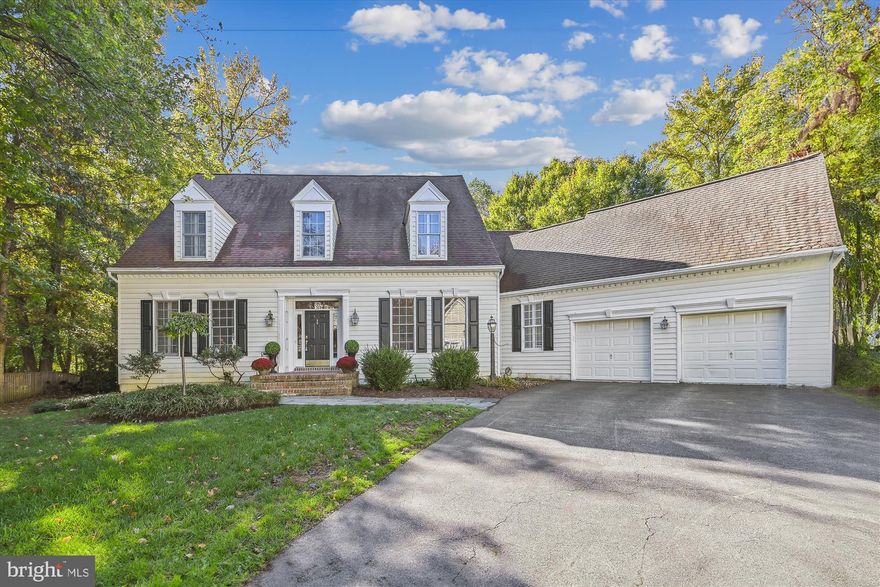This home is a lovely and spacious Cape Cod that has been meticulously maintained and features a first floor primary bedroom and bathroom originally built by Koch Homes.  On the main level there is a two story foyer, a family room with a brick fireplace, a separate dining space, an office with built ins, a large kitchen with an eat in area, a first floor laundry room plus a powder room, The main level features hardwood flooring as well as hardwood stairs to the second floor. The first floor also offers a beautiful deck and pergola surrounded by a gorgeous and secluded backyard plus a two car garage. The second floor features a loft, two bedrooms and a bathroom. The basement was recently improved with living space, a kitchenette, spacious bathroom and a guest room plus there's plenty of storage!  The community of Harness Creek Overlook is close enough to enjoy the amenities of the surrounding areas such as Quiet Waters Park, Great Frogs Winery, and Downtown Annapolis restaurants and shopping, but still in a secluded, beautiful community. Welcome home!