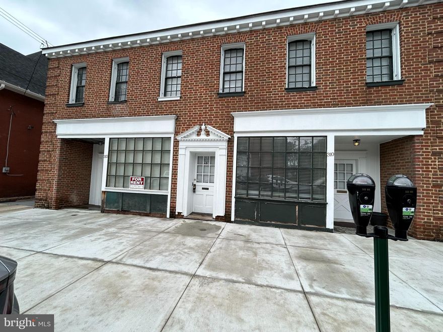 Large office space available located on the second floor of this beautiful historic building in downtown Martinsburg. Over the years this building has been used for medical offices but could be used for a variety of businesses. This space has three large rooms, large half bath and kitchenette/storage room area.  Professionally managed and includes trash collection, maintenance by request, 24 hour monitored security, and shared parking lot in back. Tenant will be responsible for electric; this space has its own electric meter and thermostat for heating and cooling. Additional $50 a month charge for water & sewer. Tenant would also be responsible for any internet/cable or technology desired. Can join shared internet for $60 a month. Great location to the downtown; courthouse, banks and restaurants. Call for your tour.