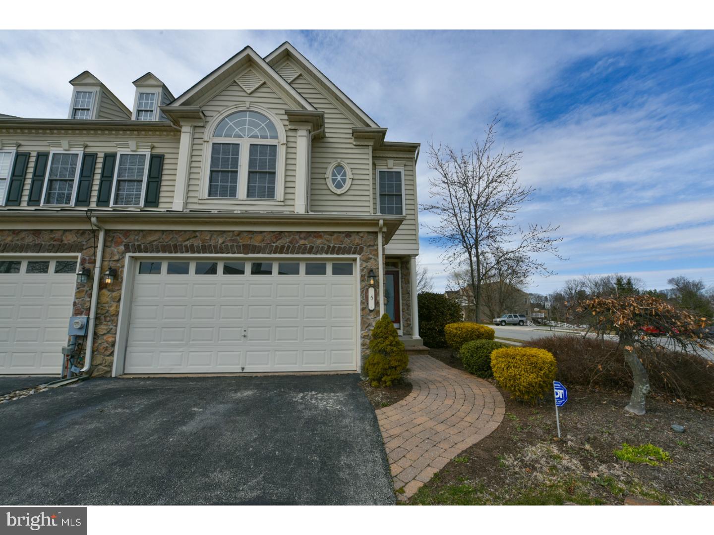 The former model home in Coventry Glen is available to become your new home.  This beautiful luxury unit is in "like new" condition has all the premium upgrades you'd expect and features abundant, detailed trim work throughout and 3 FULL baths.  Enter the bright open foyer of this stunning end unit and realize there is nothing to do but move in and unpack.  Gleaming wood floors in much of the main level. TWO car garage, dining room with built in shelving, tray ceiling, accented by custom trim and crown molding.  Elegant turned wood staircase bathed in natural light from an array of architectural windows.  The kitchen and family room flow together for a wide open, well lit space with many recessed lights.  42 inch cherry cabinets, granite, two tiered counter and upgraded stainless appliances include a double wall oven, a great space for cooking and entertaining.  The family room showcases a custom floor to ceiling window, gas fireplace and lovely wood floors. There is access to the roomy deck from double doors.  The master suite is a study in luxury with lots of windows and wide moldings, octagonal shaped tray ceiling.  Double doors lead to the large master bath with upgraded tile, soaking tub, his and hers vanities and oversized glass enclosed shower with separate toilet room.  Two additional spacious bedrooms, full bath and laundry room finish out the second level.  A full finished basement offers a great spot to entertain friends with a TV area, bar space with Corian counters, refrigerator, sink and dishwasher plus a full bath.  Sellers are flexible with closing.  This is a truly beautiful, move in home with neutral fresh paint in AAA condition.