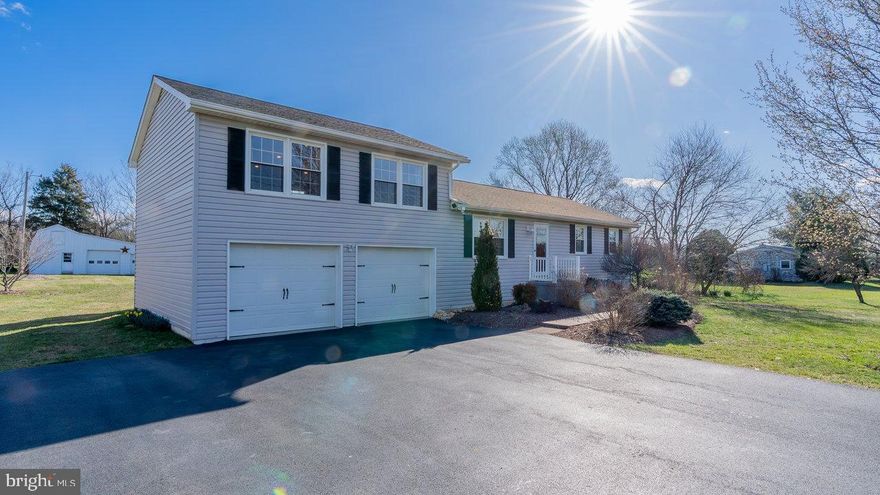 Nestled on 0.55 acres in the highly sought-after Turner Ashby school district, this well-maintained home offers a serene setting with breathtaking countryside views and a spacious, flat lot. Inside, you'll find a large, oversized kitchen perfect for cooking and gathering, featuring custom cabinetry by locally owned Mill Cabinets. Beautiful hardwood floors and an oversized family room create a warm and inviting atmosphere.  Recent updates, including a new roof and new HVAC, provide peace of mind and energy efficiency. The partially finished basement offers additional living space with room to expand, while the 20x32 outdoor garage with 220-amp electricity is perfect for storage, hobbies, or a workshop. An additional 20x10 storage building with a loft ensures ample space for all your needs.  Step outside to enjoy professional landscaping, a large deck, and a spacious patio, ideal for outdoor living and entertaining. This rare find in a desirable location has replacement windows and a long list of updates.  Schedule your showing today!