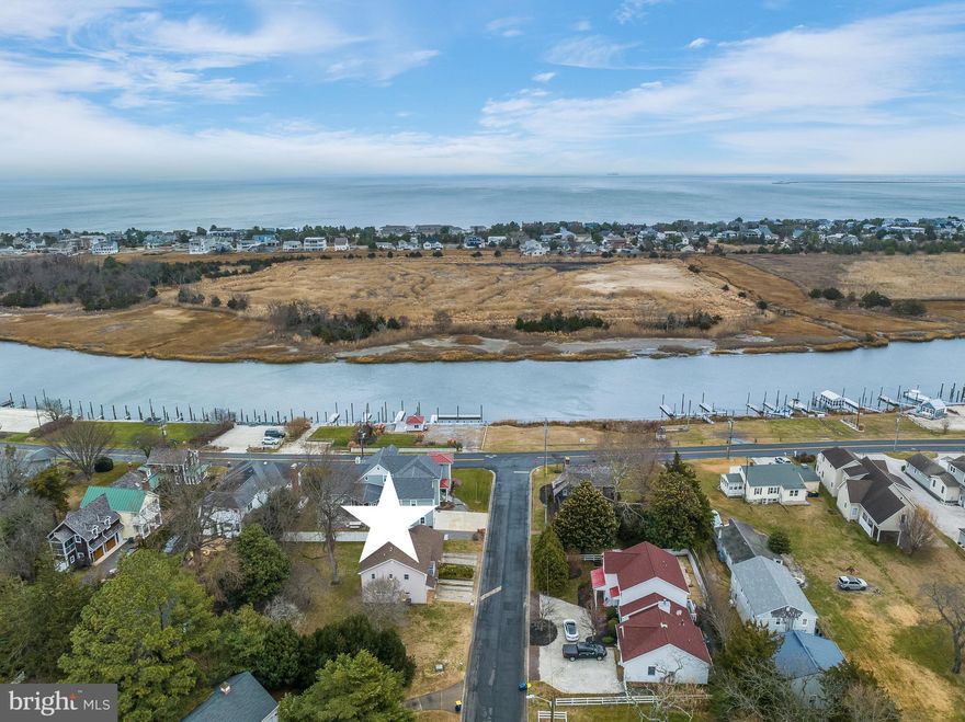 Nestled just a short walk from town, this cozy 2-bedroom, 1-bathroom home built above four oversized garage bays with storage for bikes, kayaks, beach chairs, boogie boards and more  is the perfect spot to live in or rent out while you plan your dream home! Additionally the garage storage features built in cabinets and double mud sinks. The property sits on a large .27 acre lot on a dead end street with no through traffic with scenic canal views, offering both tranquility and potential. Off street parking  for multiple cars or your favorite boat or jet ski is an added bonus. Whether you’re looking to expand the existing structure or start fresh with a new build, the possibilities are endless. The spacious lot gives you room to grow, with easy access to local amenities and a serene environment to call home.

Lewes, Delaware the first Town in the First State is known for it's welcoming community feel and relaxed style of living. This Harborview Road location allows for a short stroll into town to visit the Zwaanendael Museum, the Lewes Library or the Canal Front Park. You won't want to miss the great concerts in the park during the summer season. Boat enthusiasts will find the Lewes public boat ramp and docks 9/10th of a mile down Pilottown Road. Nature lovers can enjoy the scenic Cape Henlopen State Park and its walking and biking trails just over two miles away.  Lewes offers quaint local shopping and unique dining experiences. The beach is the main attraction for many as there is something so calming about the water and sand on your toes. Whether you prefer the Delaware Bay or the Atlantic Ocean, both are available to enjoy just 1.5 miles to 3 miles east respectively.  Setting sail on the Cape May Lewes Ferry for a day trip is also convenient as it departs 2.2 miles from this home. 
Lewes is enjoyed for all these reasons by year round residents, second home owners, vacation travelers and is well known as one of the best retirement destinations. Don't wait, make your plans to call Lewes home today!