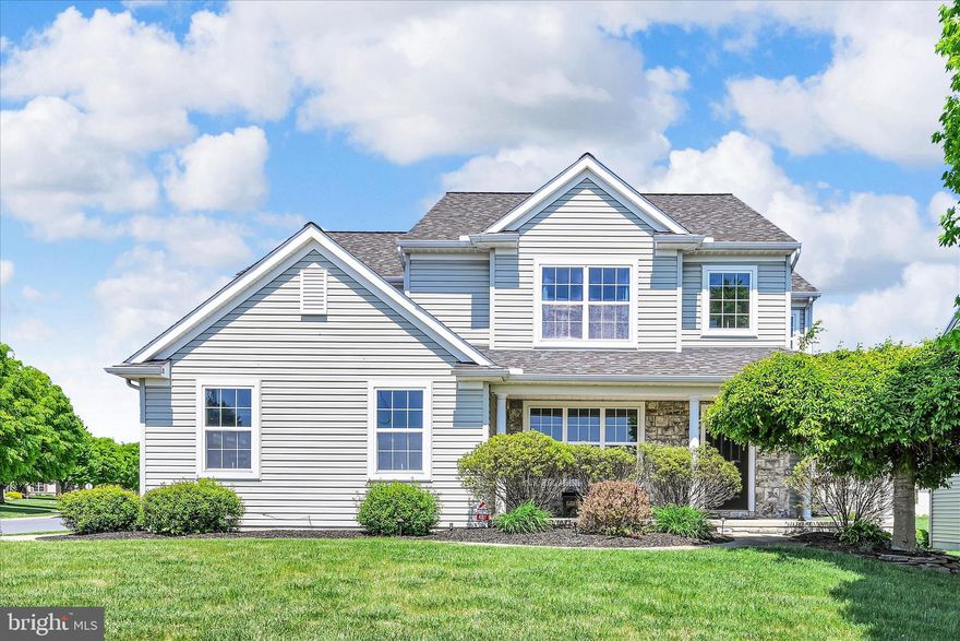 This superbly located home built by EG Stoltzfus is sited on a corner lot in Hempfield Crossing just steps away from the Hempfield High School campus.
The first floor welcomes you with an open floor plan with generous room sizes, an eat-in kitchen with plenty of cabinet space and a useful island for food prep, a living room featuring a gas fireplace, a spacious dining area and a powder room. Just inside the house from the garage is a laundry room with a convenient place to drop coats and shoes as you arrive home. Upstairs has a primary bedroom with an en-suite bathroom with double-bowl sink. The remaining bedrooms are generously sized and share a hall bathroom. The basement has been beautifully finished with a coffered ceiling, custom bar, built-in cabinets and storage, a family room and additional rec space. The Superior Wall foundation system provides insulation and a dry basement. Outside is a patio with a custom built pergola providing inviting areas to relax and enjoy the outdoors. This well-maintained home provides a move-in ready option in a very desirable neighborhood in one of Lancaster's premier school districts. Schedule your tour today!