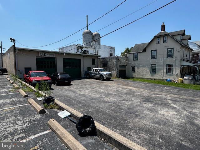 Amazing space for an automotive use. Car lifts are already there. Ample parking and large interior. approx 67x21 (1404 sf) with high ceilings. Garage door and private entrance. Left hand side of the building with left side of the driveway for parking. Must tour.