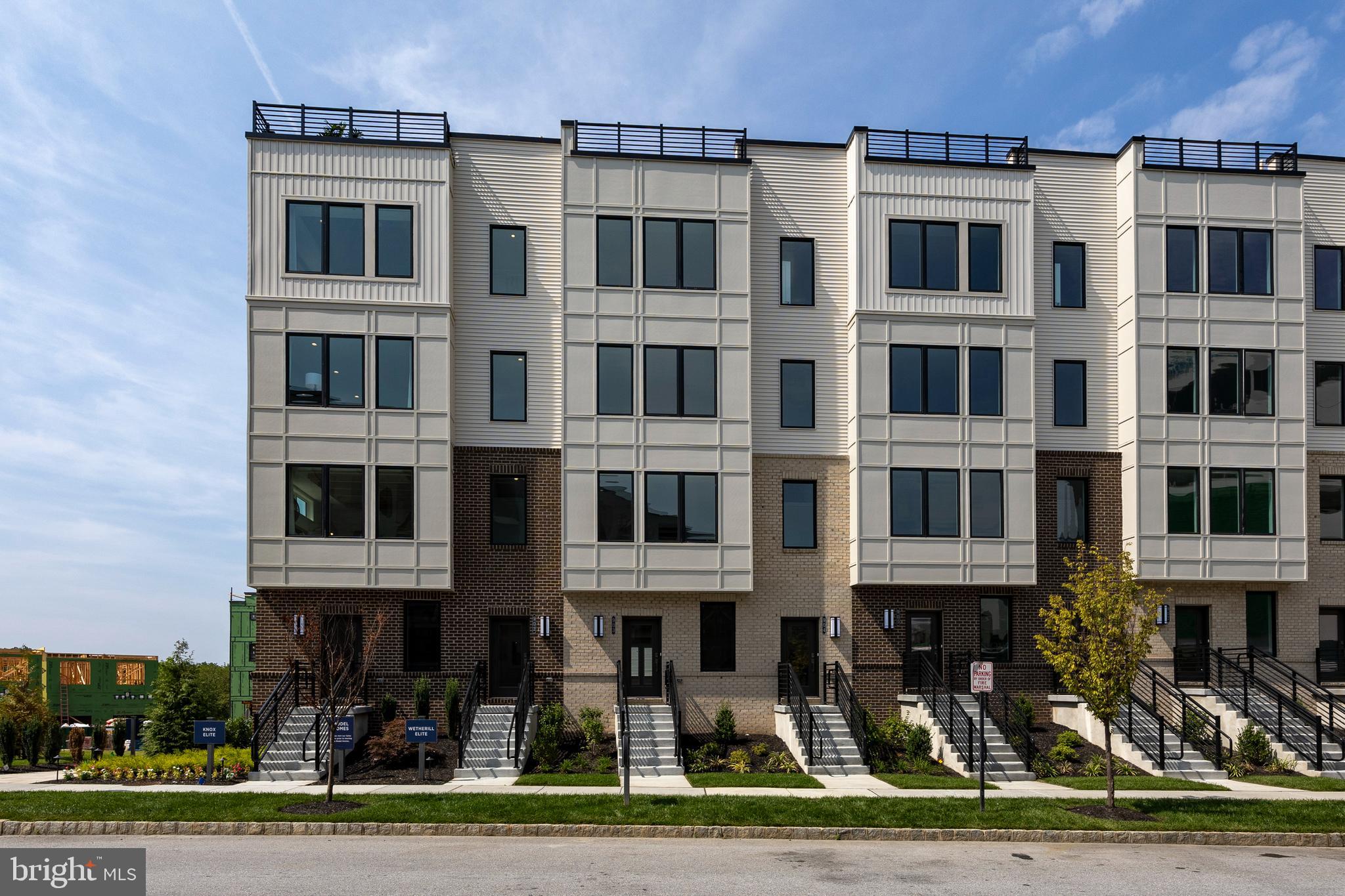 Introducing the epitome of modern living: this practically brand-new construction townhome, from Toll Brothers, offers everything you're looking for in a home plus a spacious 2-car tandem garage. Nestled in the vibrant and sought-after Overlook at Town Center community, this architectural masterpiece harmoniously blends contemporary design with functionality, providing an exceptional living experience for those who seek the perfect balance between style and convenience. As you approach the townhome, you'll be captivated by its elegant facade, characterized by clean lines, large windows that allow ample natural light, and tasteful use of high-quality materials. The thoughtful landscaping surrounding the entrance creates an inviting atmosphere, setting the tone for the comfort that awaits within. Step through the front door into a world of refined interiors. The open-concept layout seamlessly connects the living, dining, and kitchen areas, fostering a sense of togetherness and fluidity. Hardwood flooring stretches across the main level, adding warmth and sophistication to the space. The living room, adorned with tons of recessed lighting, creates an ideal setting for relaxation and entertainment. The gourmet kitchen stands as a testament to culinary excellence. Adorned with quartz countertops, a massive central island w/ farmhouse sink, and top-of-the-line stainless steel appliances, it's a haven for aspiring chefs and casual cooks alike. The adjacent dining area, bathed in natural light, provides a cozy spot for family meals or intimate gatherings with friends. The 1st floor den provides the perfect space for those working from home or those working on homework. Ascending the staircase, you'll find the upper level designed for privacy and comfort. The primary suite exudes luxury, featuring a spacious bedroom, a walk-in closet with custom shelving, and an en-suite bathroom that's a sanctuary of relaxation, complete with a glass-enclosed shower with floor to ceiling tiles, dual sink vanity and separate water closet. Two additional well-appointed bedrooms and a conveniently located second bathroom with upgraded dual vanity sink and tile surround tub provide ample space for family members or guests.
One of the standout features of this townhome is the expansive 2-car garage, designed to accommodate both vehicles and additional storage needs. Whether it's protecting your cars from the elements or providing storage for your outdoor gear and tools, this garage effortlessly meets your practical needs. Outside, a charming patio area awaits, inviting you to enjoy al fresco dining or a morning cup of coffee while soaking in the serene surroundings. The meticulously planned community offers the ability to walk into the town center for groceries, dinner or any other number of activities. In summary, this new construction townhome with a 2-car garage represents the pinnacle of contemporary living. With its harmonious blend of stylish design, practical features, and an unbeatable location, it offers a unique opportunity to live in a slice of modern paradise tailored to the needs of today's discerning tenants. ***Every person listed on the lease over the age of 18 must fill out their own application.***