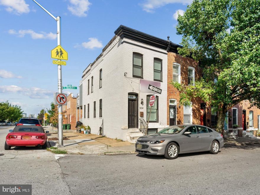 CHAP TAX CREDIT RENOVATION W/ 3 FINISHED LEVELS, OFF STREET PARKING PAD AND REMARKABLE VIEWS FROM TWO TIER ROOF TOP DECK - this home is nestled just off of Patterson Park and within convenient walking distance to the Canton Square.  The light filled end of group home features an open floor plan with hardwood floors throughout, exposed brick, crown molding, separate dining area and stylish kitchen with custom cabinetry, granite countertops, ss appliances, under cabinet lighting and tile backsplash leading to rear fenced in patio w/ parking pad.  Upper level features two bedrooms, two bathrooms with luxurious owner's suite, convenient hallway laundry room & fully finished basement!  Approximately 8 years remaining on chap tax credit, current annual taxes only $2065!!!