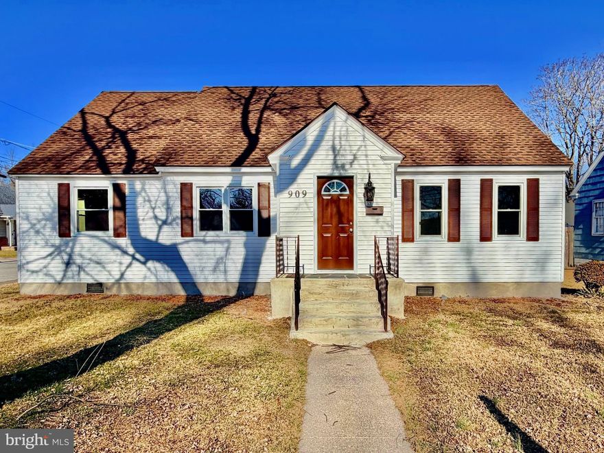 Welcome to 909 Johnson Street in Salisbury, Maryland. This fully renovated three bedroom two bathroom Cape Cod sits on a beautiful corner lot and has been transformed from top to bottom. The updates shine from the moment the front door opens. The large family room offers abundant natural light and brand new LVP flooring that flows throughout the main level. The kitchen features brand new cabinets, stainless steel appliances, granite countertops, and a waterfall style backsplash that truly stands out. The laundry room is conveniently located just off the kitchen and includes a brand new washer and dryer along with a new electric water heater. A dining area off the kitchen provides an ideal setting for hosting and entertaining guests. To the left of the dining area, a hallway leads to two comfortable guest bedrooms and a beautifully updated full bathroom with a bathtub/shower combo and single vanity. To the right of the dining area, a staircase leads to the primary suite. The entire upper level serves as a private retreat complete with a walk in closet and a full bathroom with a walk in shower. An additional unfinished bonus room on this level offers excellent storage space and has ductwork already in place, allowing for easy future finishing if desired. Outside, the property includes a double wide concrete driveway, a one car garage, and a concrete patio perfect for outdoor enjoyment. The corner lot provides an oversized front yard and strong curb appeal. The upgrade list is extensive. The home features new insulation, new roof, new HVAC, new windows, new doors, new flooring, new kitchen, new appliances, new bathrooms, recessed lighting, upgraded light fixtures, new washer and dryer, new water heater, and much more. This major renovation was completed in 2025, resulting in a fully turn key home ready for its next owners.