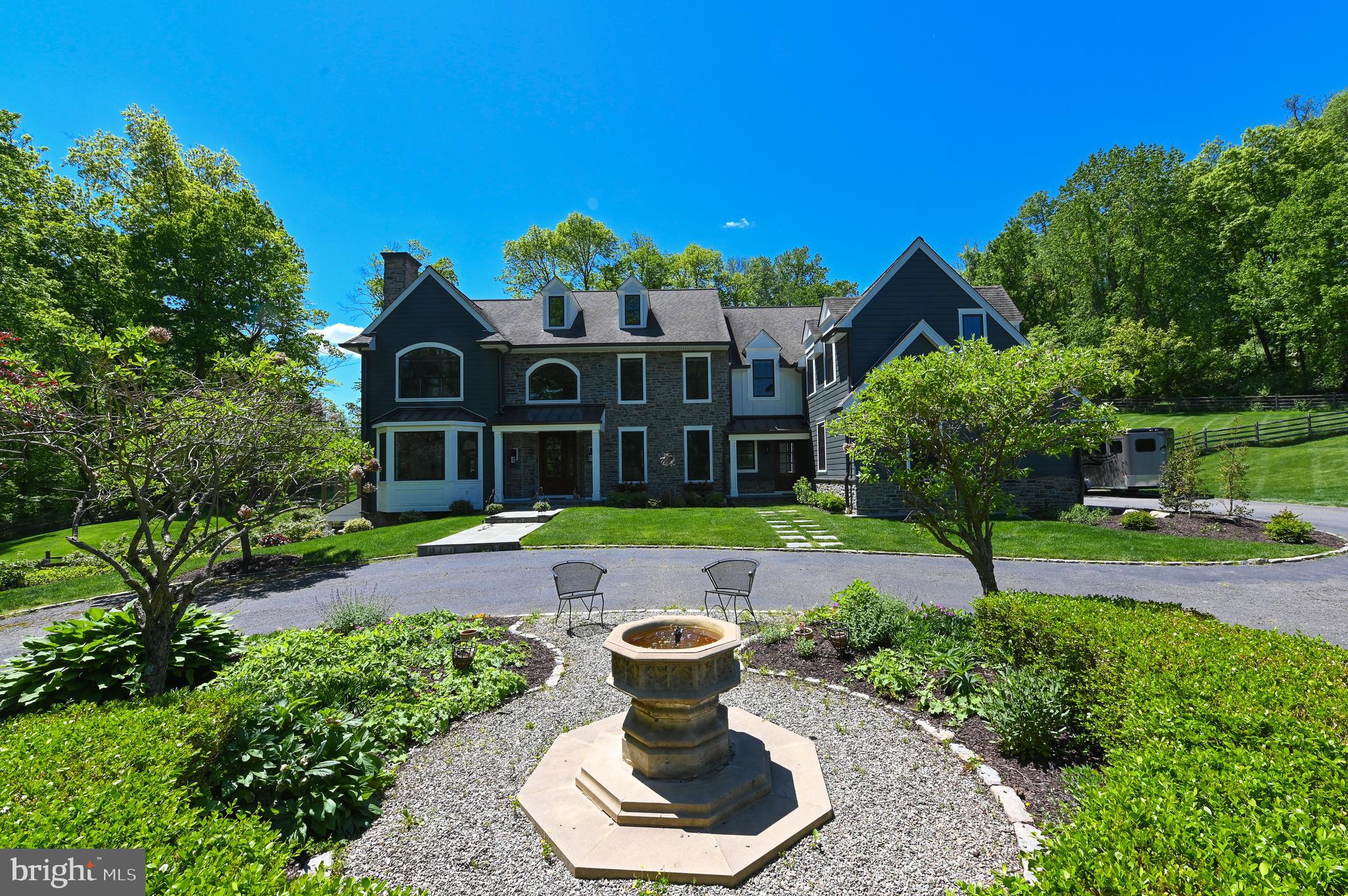 Exquisite estate manor home situated on the most beautiful park like 3.66 acre lot in the sought after Whitehorse Meadows in Charleston Township. Located off the cul-de-sac and through your ultra private, secured automatic gated entry with stately pillars, you will drive around the circular drive to your new home that is better than new construction with James Hardie Board and stone, all new top of the line Pella windows and doors, fencing, landscaping, 2 new Heating and Air conditioning systems(2018), hard wired whole house Generator served by natural gas, sprinkler system, alarm system…..and the list goes on! You will love all the beautiful custom touches and millwork to this spacious home with over 6700 square feet of both casual and elegant space for entertaining and family life, 4/5 bedrooms, 4 full baths, 3 half baths, professionally finished walk out lower level, 3 car garage and exceptional hardscaping in stone. Additional features include: Brazilian Cherry hardwood floors throughout first and second floor; plantation shutters; custom closets throughout; glorious entry foyer; living room with fireplace; library full of custom built ins; elegant dining room; spacious family room with floor to ceiling stone fireplace and access to patio; fabulous gourmet kitchen with large island, custom granite, imported stone backsplash, gas cooking and open to lovely breakfast room complete with large window seat, walk in pantry and access to the patio; mudroom area; laundry can be either on first floor or in lower level (currently); stunning curved staircase, spectacular master suite with sitting room, walk in custom closet and luxurious master bath suite; 3 spacious bedrooms all with custom closets; 3 full baths with all new toilets; large office bonus room/possible 5th bedroom; walk up floored attic for storage; full finished walk out lower level with family/media room, exercise room, half bath and plenty of storage. The covered rear patio is absolutely delightful with ceiling fan, custom lighting, electric and gas hookups for the grill and looking over the fabulous private yard; fully fenced yard; stunning landscaping with a RainBird automatic irrigation system. Be sure to check out the extensive list of upgrades in documents uploaded. The added bonus is the location in the Great Valley School District, close to major highways, Tpke entrance, restaurants, shopping and Chester Country Trail. Truly a retreat! Welcome home!