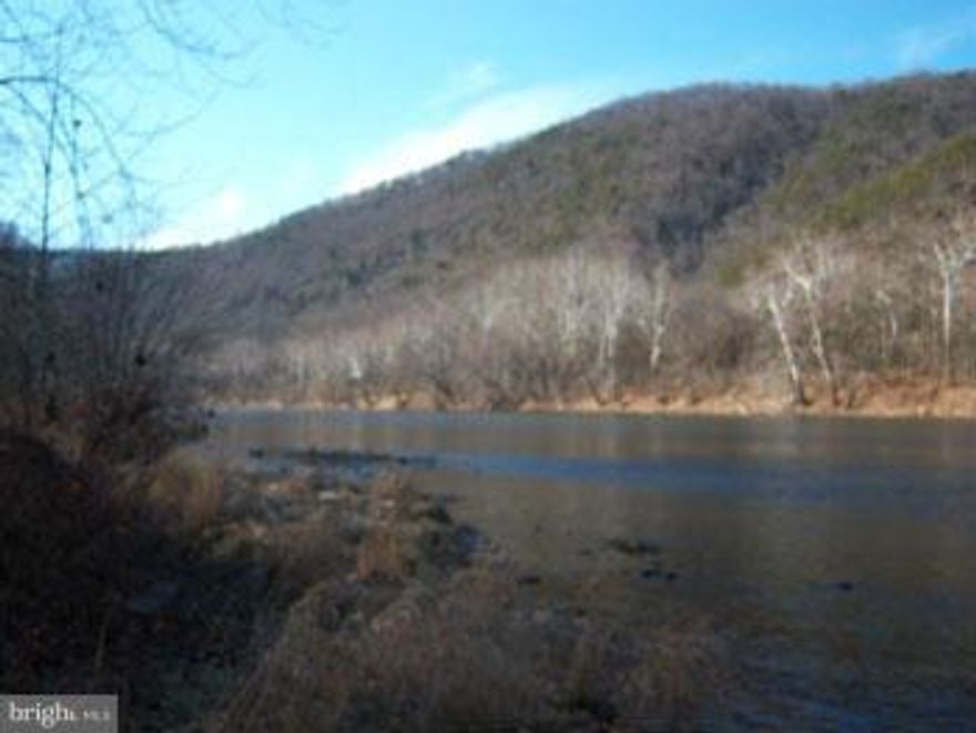 Potomac River Acreage, 34.25  very private, level acres with mature hardwoods and some open meadow area, 1490' on the river and an unobstructed view of Green Ridge State Forest. Crystal clear water, Eagles soaring, Perfect for building that get away cabin with all your outdoor related activities in mind. Gated drive, 28' Jayco Trailer, New pavilion and shed. Septic permit conveys. Call Today!