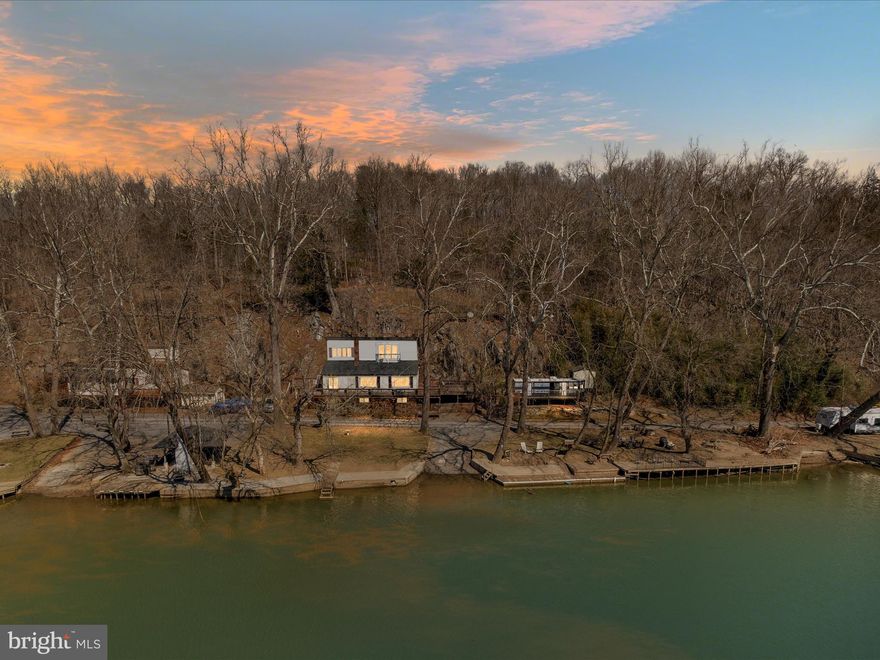 THE PROPERTY IS OWNER OCCUPIED - PLEASE BE CONSIDERATE AND DO NOT STOP AND WALK AROUND - NOR PEAK IN THE WINDOWS - UNLESS YOU HAVE AN APPOINTMENT WITH YOUR REALTOR. 
  THANK YOU 
Exclusive Riverfront Retreat on the Shenandoah River.   Sought-after area for boating!   SEE VIDEO - ONE OF THE largest lots FRONTING on the deep part of the river!! IF NOT THE LARGEST! 

Discover a rare opportunity to own a riverfront home on the deepest part of the Shenandoah River with your private access!  This property is an outdoor enthusiast’s dream, offering power boating, jet skiing, fishing, and endless relaxation. Spanning across three lots (now combined as one) with approximately 200 feet of riverfrontage, this retreat features two boat ramps, docks, a rope swing, and private walkways leading to multiple outdoor entertainment spaces.

Enjoy the spacious outdoor pavilion (new roof in 2021) complete with electric, a wood-burning fireplace/grill, a TV, and a bar—perfect for hosting gatherings. Multi-level decks, a patio area, and a personal outdoor shower provide the ultimate riverfront lifestyle.

Inside, the primary suite on the upper level is a private oasis, boasting spectacular views from a private front deck and a walkout back deck leading to a widow’s peak for panoramic river and mountain views. The luxurious primary bath includes a jetted tub, double vanities, and a shower, with crank-out windows inviting in the fresh river breeze.

The main level features two guest bedrooms, a full bath, and a great room with soaring windows framing breathtaking river views and a built-in cabinet. for storage beside the wood-burning fireplace and slate flooring in the kitchen (newer farm sink) and entryway add to the home's charm. A Cinderella-style spiral staircase in the heart of the home leads to the upper and lower levels.

The lower level offers a potential fourth bedroom,(only a few steps to access) a family room with a wood-burning fireplace, and a third full bath—perfect for additional guests or recreational space. The home is also wired for a generator to ensure year-round comfort.

This exceptional property is truly one-of-a-kind. Whether seeking a serene getaway or an action-packed riverfront lifestyle, this home has it all. Don’t miss this exclusive opportunity to own a slice of Shenandoah paradise!  

Newer windows throughout the home; new roof in 2024 on home!!! Septic inspected in 2024!   

There is so much to do at this riverfront home!