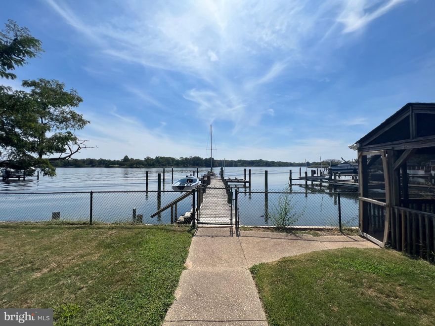 Estate sale. The waterfront pier right on the bay is the highlight of this property. Private wood pier with multiple boat slips. Detached two car garage and two storage sheds.