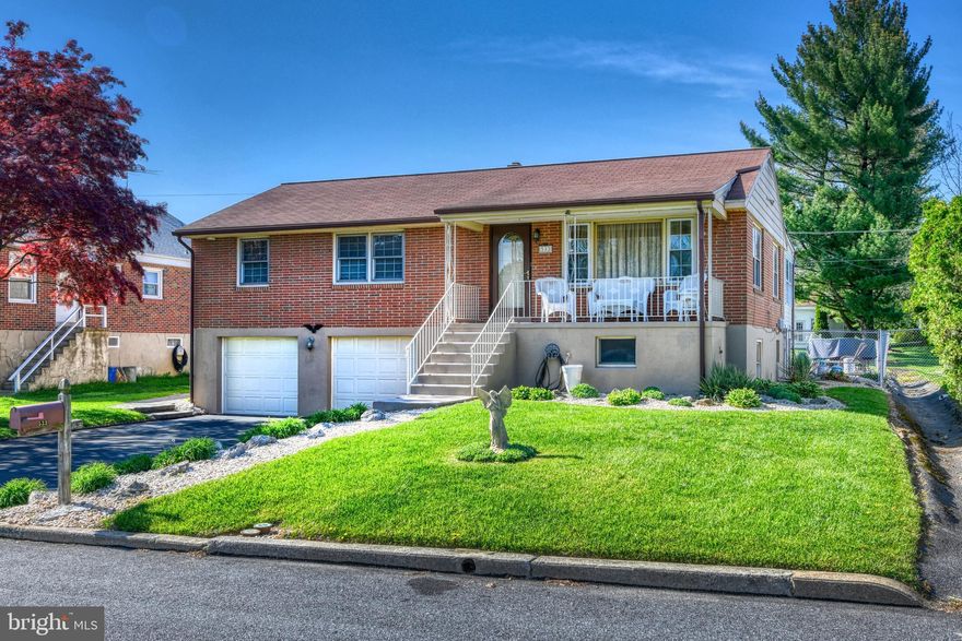 Welcome to this stunning Raised Rancher in Muhlenberg, a beautiful home that has been thoughtfully and tastefully updated over the years, that is so inviting you will not want to leave!  And is ready for its new owners to move in and start making new memories. From the covered front porch, you will enter a generously sized living room featuring lots of windows, beautiful hardwood floors and recessed lights. A beautiful open kitchen and dining area offers lots of cabinets, stainless-steel appliances, double sink, stone backsplash, and marble countertops and leads right into a sun-filled family room that features lots of windows on all three sides of the room providing fantastic views of the rear yard. Just in time for some summertime fun, there is an inground swimming lighted pool surrounded by concrete deck and four-corner lighted stone pillars. Back inside and down the hall you will find a large primary bedroom featuring two huge closets, two more nicely sized bedrooms, both featuring hardwood floors and ceiling fans, and a beautiful full bath. Moving on to the finished lower level offers 286 sq. ft. of additional living space that makes for a perfect entertainment area complete with a bar room, half-bath, storage and utility area, and half-bath and is accessible from the front of the home.  Two-car garage complete this fabulous home.  The home is part of the highly rated Muhlenberg School District. Local attractions include several camping grounds in the area, the Jim Dietrich Park, a hidden gem of Muhlenberg the offers hiking trails, special events such as annual river float in July, kayaking down the Schuylkill River Trail, and more.  Close to restaurants, shopping centers, farmers markets, and more as well as major highways. Don’t hesitate, come take a look, fall in love, make the sellers an offer they cannot refuse, then start packing.
