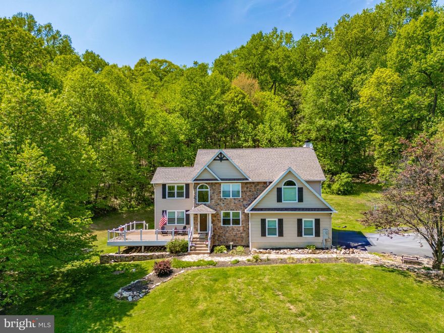 ***2.99% Assumable Mortgage Rate Available with ROAM!!  Think you have to come up with a HUGE chunk of cash for the difference??  Think again. Contact your agent or Chris Van Mol for more info***
Escape to the Enchanting Catoctin Mountains – Built in 2001 with a full remodel since 2023! 

Immerse yourself in the tranquility of the Catoctin Mountains with this exquisite 4 bedroom (with 5th room down stairs!) & 3-1/2 bath custom-built home, now boasting a complete refresh and nestled on over 7 acres of picturesque land.  Unwind in Your Private Oasis, Elevated, with beautiful mountain views and serenity! This expansive 4,000+ square foot haven offers unparalleled privacy, breathtaking views, and the peace of mind that comes with extensive modern upgrades. Step inside and be greeted by a world of elegance and comfort, now enhanced with all-new windows and doors, including a stunning front entry door, flooding the home with natural light and energy efficiency. The main level boasts a large kitchen with new appliances, a grand two-story family room with a captivating stone wood burning fireplace, recently serviced, and a formal dining room perfect for entertaining guests. The primary suite is a true sanctuary, featuring a separate sitting area, three closets, and a state-of-the-art bathroom with a massive modern style double walk-in shower and expert tilework.  



The basement offers endless possibilities for relaxation and recreation. A fully finished basement with a hand-carved bar, and a kitchenette create the perfect setting for gatherings with friends and family. An additional private room, currently used as a spare bedroom, provides flexibility for various uses like a 5th bedroom!   Enjoy the confidence of a new sump pump, water softener, and UV light water filtration system ensuring pristine water quality. 

Outdoor Living at Its Finest, Upgraded

Enjoy the beauty of nature from your new state of the art maintenance free Trex Transcends deck and railing, surrounded by mature trees and the gentle sounds of the countryside, while the property's proximity to equestrian properties adds to its allure. Enjoy the benefits and peace of mind of a brand  new 2 dimensional architectural roof with a transferable limited lifetime warranty, two new garage doors and openers, and a new pull-down attic for easy storage access. Also feel secure that the dual zone HVAC is only 5 years young. 

Modern Comforts Throughout

This home has been meticulously updated with new carpet, fresh paint in every room, new flooring, new fans and light fixtures, all new toilets, sinks, and vanities. The mudroom now features a new utility sink, adding to the home’s practicality.

Location, Location, Location

This idyllic retreat is just steps away from the renowned Celebrations Cellars Winery, offering the perfect opportunity to indulge in local wines. Explore the natural beauty of Cunningham Falls State Park or visit nearby orchards for fresh produce. And yet, you're just minutes away from the vibrant downtown Frederick, providing easy access to amenities and cultural attractions; minutes away from Route 15 and I-70 for a quick commute! 

Don't Miss This Rare Opportunity – Now Move-In Ready with Fresh Paint and Everything Updated or Replaced!

This is more than just a house; it's a lifestyle. Experience the tranquility of the mountains, the charm of country living, and the convenience of city life all in one extraordinary, fully renovated package. Schedule your private tour today and discover your mountain escape.

**For assumable Mortgage Rate questions please see document in listing or reach out to Listing agent!**