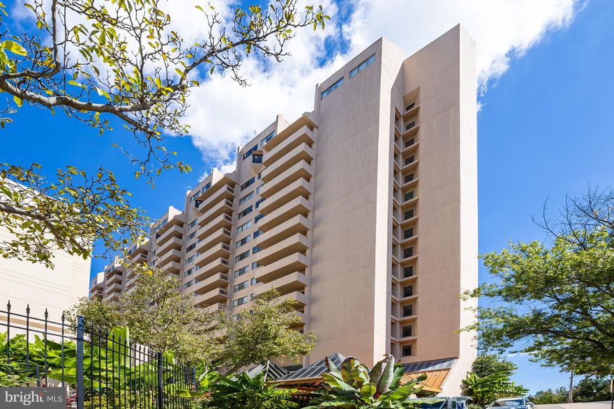 Bright and updated 1-bedroom, 1-bath condo with modern upgrades in the heart of Courthouse Arlington. Recently updated, this home features beautiful new flooring, fresh paint, and stylish upgrades, making it move-in ready. The smart floor plan maximizes space and functionality. Ample closet space, included storage, and a deeded indoor garage parking spot add convenience. The living and dining areas flow seamlessly onto an expansive balcony, perfect for morning coffee or evening relaxation. A wall of windows fills each space with west facing natural light. The renovated kitchen is a chef’s delight, boasting quartz countertops, under cabinet lighting, abundant storage and generous counter space, with high-end appliances. The spacious bedroom offers a private retreat and large closets, complete with a remodeled bathroom featuring modern fixtures and finishes.
The parking spot provides easy vehicle access, with additional room for bike storage. Extra storage locker is on the same level as parking. Located in the vibrant Courthouse neighborhood, you’re just a block from a weekly farmer’s market and  near Courthouse Metro station (1/4 mile), making commuting effortless. Proximity to transportation, trails, Amazon HQ2, National Landing, Georgetown, DCA, and the Pentagon enhances this prime location’s appeal. Woodbury Heights amenities include an outdoor pool, lounge, fitness center, concierge, and on-site management. Hot water and window maintenance are included in the HOA fees. Surrounded by dining, shopping, educational, and entertainment options, as well as parks, this condominium offers a lifestyle of comfort, convenience, and enjoyment. Don’t miss the opportunity to own this stunning home in one of Arlington’s most sought-after communities.