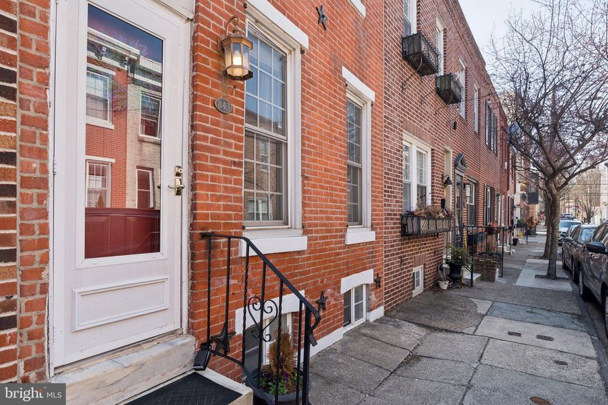 Welcome to 843 North Bambrey, a classic brick Philadelphia rowhome on one of Fairmount’s most desirable blocks. Well maintained and thoughtfully updated over the years, this home offers 2 bedrooms, 1 full bath, and over 1000 square feet of well-utilized living space, plus a finished basement and a private rear patio.

Inside, you’ll find warm hardwood floors and an open living and dining layout that works for both everyday living and entertaining. The staircase placement along the same wall as the front door makes furniture layout easier here. The kitchen is bright and functional, with a window over the sink and direct access to the nicely sized rear patio perfect for morning coffee, a glass of wine, or grilling outside.

Upstairs features a skylit hallway and two well-sized bedrooms. The primary currently holds a king bed and includes a reach-in closet, while the second bedroom offers flexibility for guests, a home office, or nursery. The full bath is clean and updated with a jetted tub. Downstairs, the finished basement adds valuable extra living space along with laundry and storage. Several key updates have already been taken care of including HVAC systems and water heater, rear fence, brick pointing, and fresh paint so you can move in and enjoy minus the to-do list.

Location is what really sets this apart. Bambrey Street is quiet, tree-lined, and right in the middle of everything. You’re a short walk to local coffee shops and neighborhood cafes, with easy access to Kelly Drive, museums, and the Schuylkill River Trail. I-76 and public transit are close by for an easy commute, and Center City and all that it offers is within walking distance.