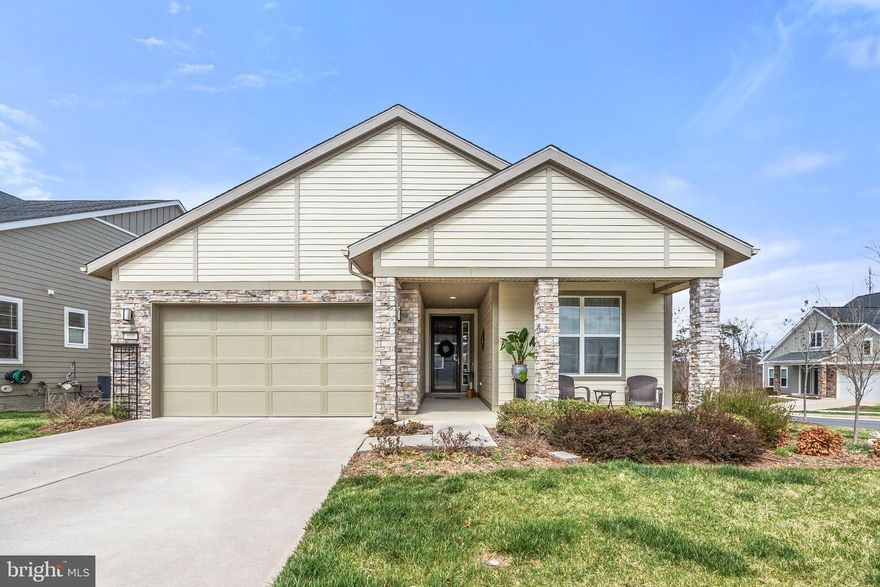 Welcome to luxury and low-maintenance living in the heart of the award-winning Trilogy at Lake Frederick—a premier 55+ active adult community by Shea Homes. This beautifully upgraded NICE model offers 3 bedrooms, 3 full bathrooms, a 2-car garage, and elegant features throughout, all designed to elevate your lifestyle. Enjoy the best of main-level living with an open-concept floor plan that blends everyday comfort with stylish entertaining. The Family Room is a showstopper with a custom stone fireplace, flanked by one of two sliding glass walls that open to a large screened-in covered porch for effortless indoor-outdoor flow and steps out to an outdoor patio for watching beautiful sunsets. The Dining Room offers a charming window seat, perfect for soaking in natural light or cozying up with a book. The chef's kitchen features a large granite island, custom cabinetry, and gleaming hardwood floors. The spacious laundry room doubles as a functional hub, complete with built-in cabinets, a wine fridge, bar, and coffee bar. The primary suite is a peaceful retreat with a luxurious ensuite bath and custom walk-in closet system. Also on the main level, you'll find a second bedroom, full bath, and a versatile office/den perfect for working from home or relaxing with a good read. The finished lower level expands your living space with flexibility and style. It includes: A generous 3rd bedroom and full bath, ideal for guests; A well-appointed kitchenette for extended stays or entertaining; A large rec room for hosting and relaxing; A multi-purpose room perfect as a media room, home gym, or game room; and A cozy office/den featuring a cedar accent wall. Whether you're entertaining family or simply enjoying the peace and quiet, this home offers room for it all—inside and out. Enjoy a wealth of resort-style amenities, including a private clubhouse, indoor and outdoor pools, fitness center, restaurant, walking trails, lake access, and a vibrant, welcoming community. 100 Gadwell Lane isn’t just a home—it’s the lifestyle you’ve been waiting for.