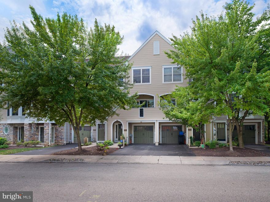 Welcome to this impeccably maintained, townhome located in the highly sought-after Ardmore Crossing community within Lower Merion Township. As you step inside, you are greeted by an entrance foyer that leads to a comfortable family room.  Sliding glass doors brighten the space.  It opens onto a rear patio, and beyond, to a manicured common lawn space, ideal for outdoor relaxation and entertaining. A laundry room and garage are also conveniently located on this level. 

Ascending to the main level, you'll find an abundance of natural light highlighting the open floor plan, complete with hardwood flooring throughout. The expansive living room and dining area are complemented by sliding doors that lead to a covered front patio, offering a delightful space for morning coffee or evening leisure. The generously-sized eat-in kitchen is equipped with exquisite cabinetry, high-end stainless steel appliances, and sleek granite countertops. From the kitchen, sliding glass doors open to another spacious rear deck that overlooks the yard, providing a perfect setting for al fresco dining and outdoor enjoyment. A powder room is also located on this level.

The next level features a spacious primary bedroom that includes an en-suite bath and a large walk-in closet with built-in storage solutions. This floor also includes a well-appointed hall bath and another spacious  bedroom, ensuring ample space for family or guests. 

The top level offers a versatile and expansive area that can be utilized as an office, a bedroom, or a combination of both, with large closets providing additional storage options. 

This townhome is within walking distance to Suburban Square, the R-5 train line, shopping, and a variety of dining options, making it an ideal location for both convenience and an active lifestyle. Don't miss the opportunity to make this exceptional townhome your new home.
