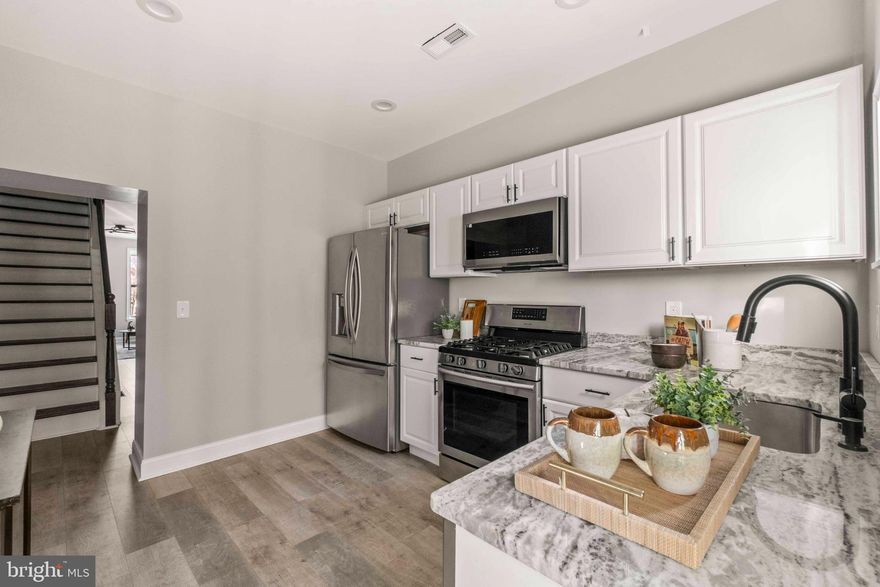 Step into modern comfort with timeless charm in this beautifully remodeled brick-front townhouse, nestled in the heart of Washington Village/Pigtown. 

Highlights include:
- 3 bedroom and 3 full bathrooms. The convenience of adequate bathrooms cannot be overstated. 
- Classic curb appeal with a traditional brick façade that blends seamlessly into the historic streetscape.  
- Freshly remodeled interior featuring updated and new wood flooring, neutral paint tones, and stylish finishes throughout. And a deck off the 2nd bedroom.
- Modern kitchen with new cabinetry, countertops, and stainless-steel appliances.  
- Updated bathrooms with contemporary fixtures and sleek tile work.  
- Private fenced in backyard. 
- Convenient location just minutes from Camden Yards, M&T Bank Stadium, the Inner Harbor, and major commuter routes.  

This home offers the best of both worlds: historic character paired with modern updates. Whether you’re a first-time buyer or looking to add to your investment portfolio, this move-in ready townhouse is a rare find in one of Baltimore’s most vibrant neighborhoods.  
Don’t miss your chance to own a piece of Washington Village/Pigtown history with all the comforts of today.