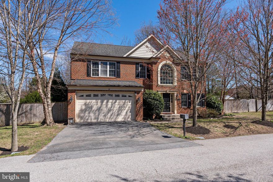 Welcome to 7703 Brasswood Lane, where elegance and comfort meet on a beautifully landscaped 0.9-acre corner lot in sought-after Brasswood Estates. This meticulously cared-for 4-bedroom, 2.5-bath colonial offers more than 4,300 square feet of refined living space. A dramatic two-story foyer and rich hardwood floors set the tone, leading into a spacious chef’s kitchen with granite countertops, stainless steel appliances, and a large center island perfect for everyday living. The main level is thoughtfully designed for both entertaining and relaxation, featuring formal living and dining rooms as well as a sun-filled family room anchored by a cozy gas fireplace. Upstairs, the luxurious primary suite provides a private retreat with dual walk-in closets and a spa-inspired bath, while three additional generously sized bedrooms offer flexibility for family or guests. The finished lower level adds even more living space, complete with a renovated recreation area and home gym. Step outside to a fully fenced backyard designed for enjoyment, featuring a paver patio, mature trees for added privacy, and a built-in sprinkler system. This exceptional home combines space, style, and functionality—schedule your tour today!