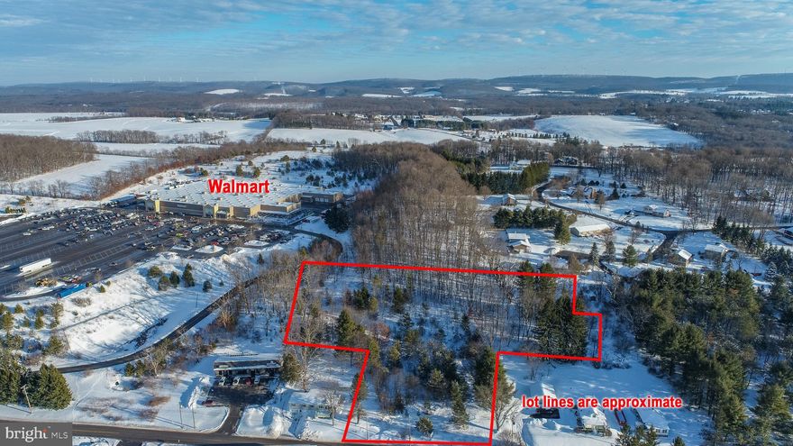 Just over three acres in a prime location in Oakland, Maryland. Property borders the south side of Wal-Mart property and has deeded access from the south entrance of Wal-Mart.  Property is wooded but has several flat spots perfect for building. Owner has hired a civil engineer to draw plans for a restaurant, and an office building. Plans are available for review.