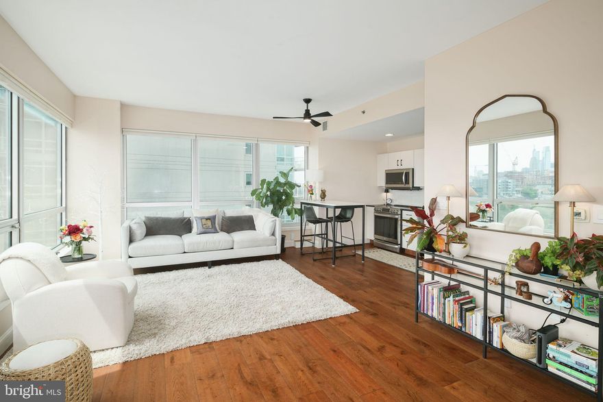 P605 is a bright, freshly renovated, CORNER unit in the Peninsula with a sun-soaked Southwestern exposure.  No expenses were spared in this renovation, and only eight of this style floor plan exist in the entire Waterfront Square community!  The unit showcases panoramic, unobstructed views of the Delaware River, Ben Franklin Bridge, and Center City Skyline through oversized floor-to-ceiling windows.  The floor plan is perfectly open, and one can admire the views as soon as they step into the unit, while cooking in the kitchen, or watching TV in the living room.  The kitchen has bright white cabinetry, honed-finish matte black granite counter tops, white Marble backsplash, and state-of-the-art stainless-steel appliances!  The stove has Sous Vide and air fryer settings with remote start capability!  The periphery of the kitchen is adorned with recessed lighting, and the space between the kitchen and living room has a nice ceiling fan.  The bathroom is over-sized and features 12-inch Marble tiles throughout.  There is also a deep Kohler jetted tub with 8 fully independent jets, a beautiful white granite vanity with Carrara Marble like striations, adorned with gold sconces and gold hardware, and an extremely high-tech toilet with the following features: Bidet washlet, heated seat, auto flush and eco setting!  The bedroom is large enough to house a King size bed, and has a reach-in closet with custom closet built-ins.  There is a washer/dryer closet in the hallway, as well as closet for additional storage.  One PARKING LICENSE IS INCLUDED, and heating and cooling is included in the condominium expense!  Waterfront Square Condominium & Spa is a premier gated community offering 24/7 guard and gate, as well as concierge, valet parking, pool and hot tub with river deck, fitness center, sauna and steam room, massage rooms and community rooms. There is a 3- level garage, with Philadelphia's largest green roof situated on top, inclusive of putting green! Waterfront Square resides on a 9.5-acre riverfront enclave, with lush manicured outdoor common parks and gardens right on the river's edge. Management is on site, and Waterfront boasts an advanced security system with closed-circuit television. For your convenience, Global Limousine runs on site Monday-Friday, taking residents as far as 30th street and back home to their gated community. The river deck is oversized, encompassing a 25-meter heated lap pool (junior Olympic). Waterfront Square has an excellent location, due to its proximity to area highways & airports (676,95, all bridges), yet is nestled away on the Delaware River - the best of both worlds! If its unequivocal luxury, showcasing the best views in Philadelphia, adorned with amenities, then it must be Waterfront Square Condominium & Spa!