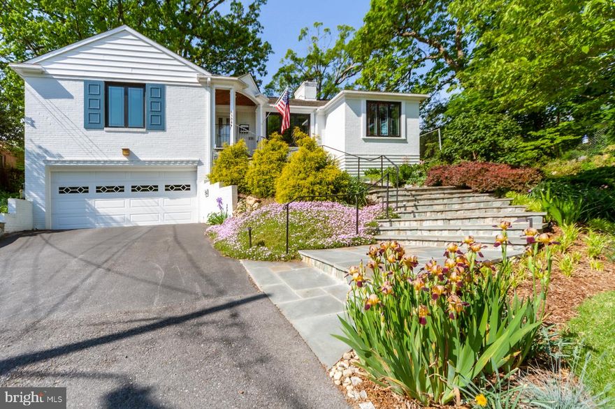 Welcome to this delightful Mid-Century home located at the end of a quiet lane in the heart of Chevy Chase. The setting is a true gardener’s paradise! An elegant stone staircase meanders through a picturesque garden of flowers and plantings and leads to the welcoming foyer entrance of the home. Inside, the spacious foyer opens up to a gorgeous living room with a romantic, wood burning fireplace. A glorious sunroom beckons you beyond the living room, and into a garden oasis. Green space is a premium in Chevy Chase, and this home has it in spades! Mature plantings and low maintenance landscaping ensure immediate enjoyment for the next owner of this special home.   The kitchen is spacious and boasts granite countertops and stainless steel appliances, and more storage than you’ll ever need! The kitchen opens to a pretty dining room with beautiful windows and plenty of room for hosting friends and family, as well as more intimate gatherings. Both the kitchen and dining room enjoy a western exposure with sunset views over the park.   Also on the main level are a three generous-sized bedrooms and two full baths, including the primary bedroom and en-suite double-vanity bathroom. Gleaming oak hardwood floors are present throughout the main level of the home. The lower level has an enormous recreation room, second wood-burning fireplace, laundry, storage room and a half bath. A rare two-car garage is attached to the house and offers even more space for a work bench, bikes, or to create a mudroom or peloton room – the possibilities are endless!      The location of this park-side home cannot be underestimated. Shepherd Park is a popular gathering spot for so many Chevy Chase activities, including family picnics, sports practices, doggie playdates, and of course, the best sledding hill in Chevy Chase! It is truly a neighborhood gem. Also within walking distance are the Shops at Brookville, La Ferme, weekly organic farmer's market, and the highly-regarded CCUMC Preschool, which serves as a feeder to the stellar Chevy Chase public school cluster. Walkability, quiet setting, and eligibility for membership in the popular CCRA Swim & Tennis Club, make this a smart choice for today’s homebuyer.