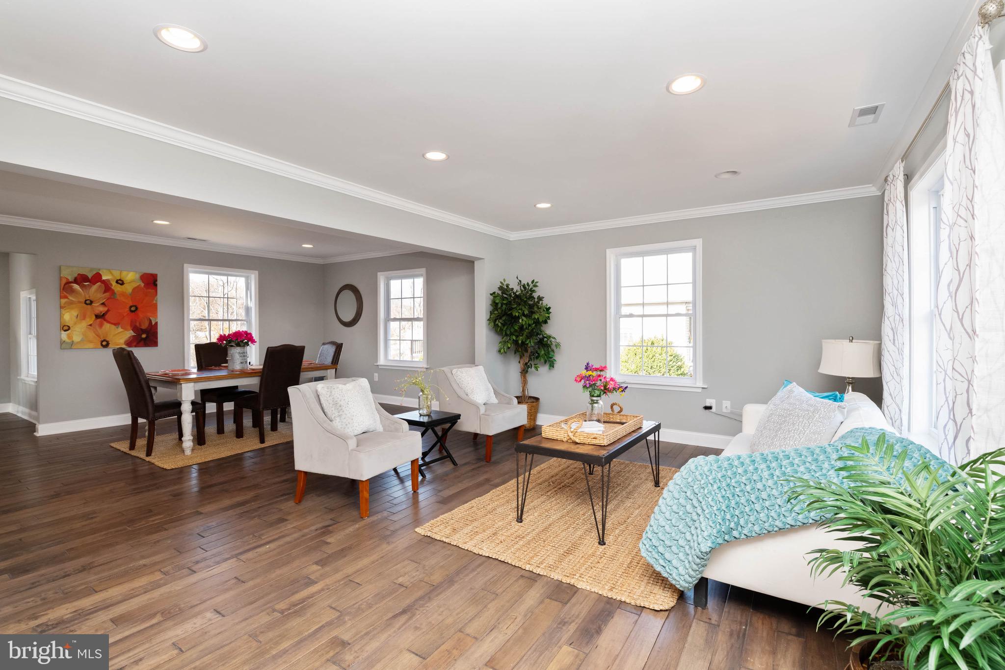 This beautiful newly renovated Cape Cod is so much larger than it appears from the front. Make sure to check out the video tour, a must see. This home features Master Suite-2 closets on main floor, 2 large bedrooms and potential 3rd on top floor. Use it as a rec. rm, kids play rm, or study, willing to add door to make it a 4th bedroom. Kitchen features modern white shaker cabinets, crown molding, breakfast bar, granite, and stainless steel appliances. Family RM, dining, kitchen, sunroom, open concept, hardwood floors, crown molding, recessed lighting. Basement fully finished, full bath, attached 1 car garage, driveway has easy turnaround. Large deck off the sun room approx. size 400 sqft. New baths, roof, windows, HVAC, duct work, plumbing , electric, french drain, doors, walls, gutters and so much more. $1,000 toward an additional renovations on a contract accepted by seller no later than 12/10. Home is fully permitted by the county. City water, septic.