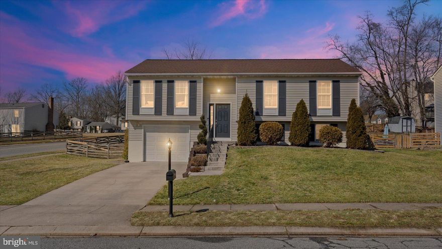 Beautifully maintained and move-in ready 3BR/2.5BA split foyer home located on a sprawling corner lot in the desirable neighborhood of Box Hill.  Park just steps from the front door into your forever home.  Step inside a home filled with natural light, a soft color palette, luxury flooring, recessed lighting, and an open main floor plan.  The main floor offers a spacious living room, dining room, and a stunning kitchen.  The kitchen features plenty of cabinets, a separate pantry closet, stainless steel appliances including a slide-in electric range, beautiful quartz countertops with a subway tiled backsplash, a stainless farm sink under a window, and an island with pendant lights, and breakfast seating.  Down the hall are two sizable secondary bedrooms, a full bath, and a primary suite.  The primary suite features a spacious bedroom, a large closet with barn doors, and a private full bath with a walk-in shower.  The lower level offers additional living space featuring a large family room, a half bath, storage, laundry, access to the one-car garage, and sliding doors to the split-rail fenced yard.  From the dining room step through the sliding doors onto a large wood deck that overlooks a yard filled with tons of green space and possibilities.  This move-in-ready home offers new homeowners ample living space, and is conveniently located near shopping, restaurants, and commuter routes.