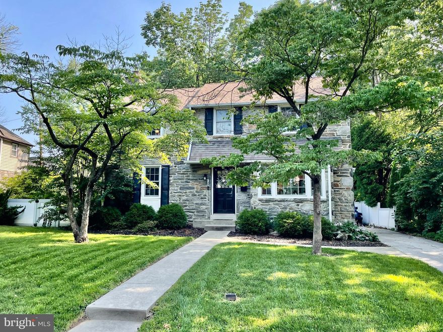 Welcome to this beautiful stone home in Penn Wynne (Lower Merion). Located on a beautiful tree lined street, this home offers a wonderful opportunity with modern features and updates. Walking up to the home you'll notice the nice size yard and private driveway. Entering the home, the 1st floor presents great spaces including a large living room with built-ins and fireplace (non functioning) and an open dining room (currently set up as secondary entertaining space) that leads to a renovated kitchen with large breakfast bar, stone countertops, white cabinetry, tile backsplash and stainless steel appliances. Sliders off the back of the kitchen lead out to the back yard and patio, as well as, to the attached 1 car garage. Heading to the second floor from the center hall, you'll find a generous sized main bedroom with renovated ensuite bathroom that includes a stall shower. The 2nd floor also includes 3 more bedroom and a full renovated hall bath with 2 sinks and tub. Off the kitchen, you'll find another set of stairs down to the unfinished basement. With high ceilings and bright lights, this space could be used as and additional living area, offers great storage, laundry hook ups, and 1/4 bath. Other great features include hardwood floors and central air. Located minutes from parks, schools, public transit and shopping, as well as, provides great access to Philadelphia via car, trolley, bus or train. This home is also located in Lower Merion School District. Potential tenants must make an application that includes a credit check and background check. Owner requires a minimum credit score of 675.