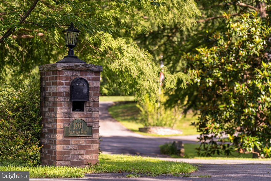 Discover timeless elegance in this all-brick Colonial masterpiece, nestled on a private 1.8-acre lot in Herndon, VA, within the highly sought-after Langley High School Pyramid. Just over 5000-square-feet, this estate offers 4 bedrooms, 3.5 bathrooms, and a lifestyle of comfort & privacy for those looking to live like they're in the country while staying close to everything. 

Step through the grand portico entrance and brick walkway into a world of classic charm. The traditional Colonial floor plan boasts refinished hardwood floors throughout the main and upper level.  The formal living room exudes timeless features with intricate dentil molding and a wood burning fireplace.  Adjacent, the dining room captivates with a stunning bay window offering views of the sparkling  in-ground pool, complemented by refined dentil molding that adds architectural allure.  Both spaces are elevated by contemporary touches, including recessed lighting, and glass doors that seamlessly connect to the poolside oasis.  

To the left of the foyer, a sophisticated library or office awaits, featuring built-in bookshelves, an exquisite coffered ceiling, recessed lighting, a wood burning fireplace, and elegant French doors. 

Get ready to fall in love with the heart of this home—a vibrant gourmet kitchen that flows seamlessly into a sprawling, sun-drenched sunroom, creating the ultimate space for everyday living and epic entertaining! The chef-inspired kitchen dazzles with a professional-grade 6-burner GE Monogram stove with a sleek hood, top-of-the-line stainless steel appliances, granite countertops, and a generous island perfect for casual meals or lively gatherings. A walk-in pantry keeps everything organized, while the sink offers a front-row view of the shimmering pool and lush backyard, turning dish duty into a daily delight. Flooded with natural light, this open-concept haven is where memories are made.

Upstairs, you’ll find your personal sanctuary in this show-stopping primary bedroom suite with spacious sitting area, perfect for unwinding, an enormous walk-in closet to house your wardrobe dreams, and a two room ensuite bathroom.  Three additional bedrooms and loft area provide ample space for family and guests. 

The finished walk-out basement, anchored by a wood burning fireplace and built in bookshelves also has a kitchenette, tiled flooring, a flex room with a mirrored wall- perfect for an in-home gym, and a full bathroom. The possibilities are endless for this downstairs space- think playrooms, home office, workout studio, home theaters, or guest suites just to name a few. 

Outside, the private backyard oasis is a family’s dream, featuring an in-ground pool, an expansive flagstone patio, and an outdoor fireplace for year-round enjoyment. With a 1,100 square foot 4-car attached garage, there’s room for all your vehicles, hobbies, and storage needs.  The almost 2 acre lot is home to a variety of trees including, cherry, birch, oak, Japanese maple, magnolia, maple, plum, bradley pear, ginkgo, sycamore, holly and dogwood; and backs up to wooded county property.  

Perfectly located, this home is just an 8-minute drive to Starbucks and Chick-fil-A, 10 minutes to Whole Foods, Trader Joe’s, and the Reston Metro Station, 15 minutes to Dulles International Airport, and 20 minutes to vibrant Tysons Corner. Combining historic charm, modern comforts, and a prime location, this move-in-ready Colonial is the ideal forever home for you. Schedule a private tour today to experience this extraordinary property!