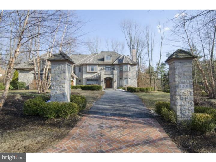 PERFECTION describes this Elegant Custom Home with finishes that won't disappoint. Built by Wayne Geftman and designed by Scott McIntyre, they've captured Old World Charm and Tradition with today's Living. The Superior appointments include Beautiful Herringbone Wood Floors, Architectural Cabinetry and Dramatic mouldings/millwork throughout. The Spectacular Kitchen and Family Room will more than meet your expectations. Handsome Paneled Library with fireplace and guest suite also enhance the amenities in the home. His and her baths and closets are completely outfitted. There are also two patios at the rear of the property for dining and entertainment. The tranquility of the lake across the road will delight you. Drive up the brick and flagstone walkway and make this impressive stone home your own.