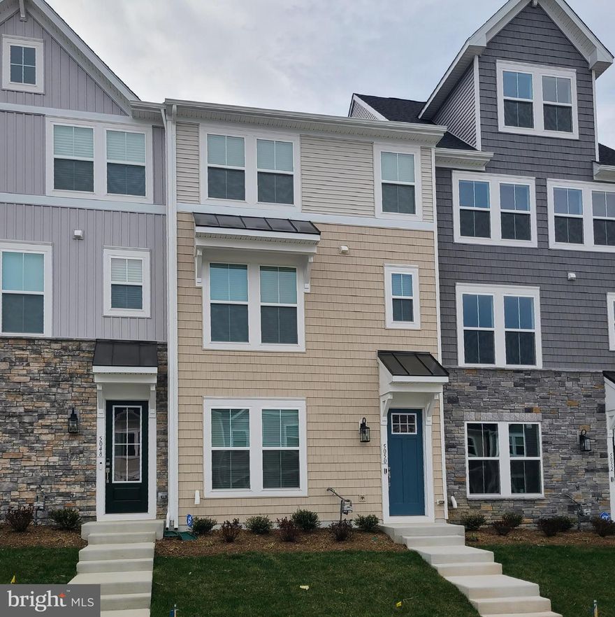 Newly completed in The Grove at Jackson Village, this fabulous 4 BR, 3.5 BA, 3-level townhouse is ready for you to call home.  It features an open great room, gourmet kitchen, and an upper deck.  There is a 1st floor BR with private bathroom, as well as a luxurious primary BR suite on the 3rd floor.  The 2-car garage is rear-entry with additional paved parking spaces, and on-street parking is available in front of the home.  This Spotsylvania County community is convenient to shopping, dining, and commuting options.