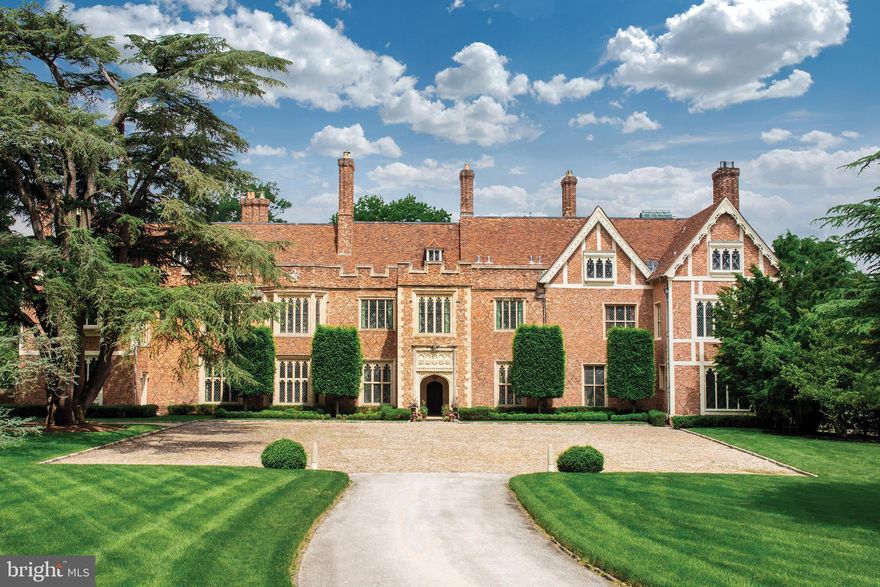 GUILDFORD, a truly rare offering, is an authentic 16th century English Tudor estate  majestically  situated on 18 park-like acres with sunset vistas and in a world of its own. Down a private lane, one enters through the gates of Guildford and is transported to the English countryside. Inspired by Sutton Place in Surrey, England using architectural elements meticulously imported and reassembled, this breathtaking home took a decade to complete in 1925. Built of reinforced concrete, Guildford's antique brickwork, roof tiles and terracotta window frames need only to function aesthetically. Carved wood paneling, elaborate cornice work, oak floors, limestone walls and stained-glass windows all dazzle as they did when they were originally installed. Upon entering, one experiences the warm majesty of the home. Designed for both elegant entertaining and intimate family life, the interiors are graced with abundant natural light and high ceilings. Past an ancient limestone archway and through an historic carved oak door, the large entry hall greets with a fireplace, linenfold paneling and stone floors. The spacious living room is crowned with ornate molding and centers on a massive fireplace. The Cedar of Lebanon paneled library is an intimate room, perfect for fireside conversations. The garden room with wet bar and tiled floral arranging room overlooks the Great Lawn and sunken garden. The 18th century paneled dining room leads to a butler's pantry and large, light-filled, modern eat-in chef's kitchen. The family and laundry rooms complete the main level. The second floor includes an opulent master suite with 2 luxurious baths and dressing areas and 4 additional en suite bedrooms. The third floor includes 2 charming bedrooms with adjacent studies, large cedar and luggage closets, ample storage, recreation and staff space. The lower level hosts a connoisseur's wine cellar, a spa, staff laundry and multiple storage areas. The home has been completely updated for 21st century living with features that include  2 elevators, 13 working fireplaces (11 wood and 2 gas), a 4-car garage, updated systems, 9 zones of heating/cooling and public sewer. A private and large home office is perfect for working remotely or as a studio. The grounds include woodland trails, pool w/ spa, terraced gardens and a landscaped amphitheater. The property is fully fenced and gated. Very private yet walkable to local train stations, shops, restaurants, galleries and golf / tennis clubs of charming Chestnut Hill. The location also allows for access to some of the areas best private schools, including Springside  Chestnut Hill, Germantown Academy and Germantown Friends. Guildford is only a short 25 minute drive from Central Philadelphia and 90 minutes  to Manhattan. This is  truly a special and magical home not to be missed. Please see  Guildford's website https://www.guildfordestate.com for more information and  video https://vimeo.com/279515663