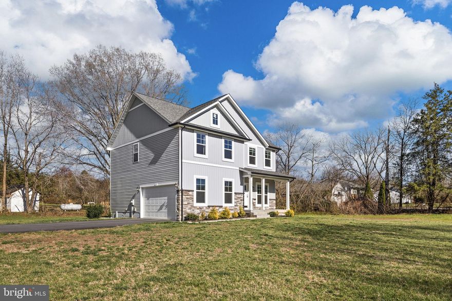 Welcome home to this beautifully designed, move-in ready 2023 construction perfectly situated on a spacious 0.53-acre corner lot—offering the ideal blend of privacy, convenience, and modern living with easy access to I-95, shopping, dining, and local hospitals. Four legal bedrooms are on the upper level(3 BR Perc)
From the moment you step inside, you’ll appreciate the crown molding, and abundant natural light that create a warm and inviting atmosphere throughout the main level. Just off the foyer, a gracious dining room sets the stage for gathering and entertaining, complete with chair railing, custom trim, and elegant chandelier lighting.
The heart of the home is the open-concept family room and kitchen, designed for both everyday living and hosting. The family room features a cozy gas fireplace with mantel, seamlessly flowing into a stunning gourmet kitchen. Here, you’ll find quartz countertops, a large center island with breakfast bar, pendant lighting, stainless steel appliances, two-tone cabinetry, and a custom tile backsplash—all complemented by a spacious breakfast area with sliding glass doors leading to the backyard.
Upstairs, retreat to the private owner’s suite, complete with a tray ceiling and a beautifully appointed ensuite bath featuring a large walk-in shower, double vanities, private water closet, and a generous walk-in closet. Three additional spacious bedrooms, a well-appointed hall bath with double sinks and custom tile, and a convenient upper-level laundry room complete the second floor.
This home offers the perfect combination of style, space, and functionality—ready for you to move in and start your next chapter.