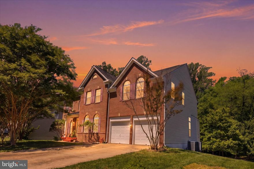 Move-in ready and thoughtfully designed, this spacious Colonial offers over 3,700 sq ft of above-grade living space with an additional unfinished walk-out basement ready for your future vision. Inside, you’ll find hardwood flooring, dual staircases, and a functional layout that blends everyday comfort with great entertaining space. The gourmet kitchen features granite countertops, double wall ovens, electric cooktop, refrigerator, dishwasher, abundant cabinetry, pantry storage, and opens seamlessly to the family room with a cozy gas fireplace. The main level also includes a formal dining room, formal living room, private office, half bath, and mudroom access from the attached two-car garage. Upstairs, the expansive primary suite serves as a true retreat with two walk-in closets, a two-sided fireplace, and a spacious ensuite bath complete with dual vanities, soaking tub, separate stall shower, and private water closet. Bedrooms two and three share a connecting bath with tub/shower combination, while the fourth bedroom offers access to an additional full hall bath. An upper-level laundry room adds everyday convenience. The unfinished walk-out basement provides approximately 1,882 additional sq ft with a rough-in for a full bath, offering endless possibilities for future bedrooms, recreation space, gym, theater room, or extended living area. Outside, enjoy the beautiful brick front, freshly painted front porch, attached two-car garage, and oversized four-car driveway. The rear yard offers a peaceful outdoor setting with mature fruit trees that produce seasonally, creating the perfect backdrop for relaxing, gardening, or entertaining. Conveniently located near major commuter routes, shopping, dining, and everyday amenities, this home offers both space and accessibility. Pricing reflects condition, and the seller is offering a one-year home warranty along with a $2,000 carpet allowance.