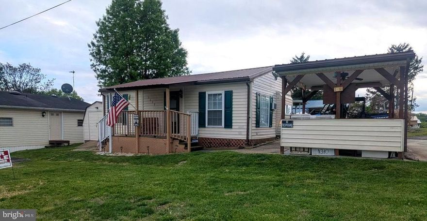 Check out this lot. This lot features two asphalt driveways, a shed, and a covered outdoor seating area perfect for grilling or relaxing. It's a sewer lot conveniently located next to a bath house for guests. Ideal for yard sales due to its great location. This is a turn-key lot, ready for you to move in and enjoy the river life. It boasts a covered front porch, making it a quaint place, and is situated on a large corner lot.

Here are some additional details that could be included:

Property Highlights:
*   Two asphalt driveways
*   Shed for storage
*   Covered outdoor seating area
*   Conveniently located next to a bath house
*   Ideal for yard sales
*   Turn-key lot, move-in ready
*   Covered front porch
*   Large corner lot
*   Sewer lot

2015 Polaris ranger XP 900 6 seater not included in the sale but available for an additional fee.
2010 Southwind 22FS Deck Boat 220 HP not included in the sale but available for an additional fee. 

THIS IS A SEASONAL CAMPGROUND! OPEN FROM APRIL 1 TO NOVEMBER 1. ** WELCOME TO RIVER BEND/SEASONAL LOT AVAILABLE TURN KEY** River Bend is a privately owned 400 acre recreational- vehicle camp resort with seasonal activities for members, families and guests. This great RV park is tucked away on the Upper Potomac River of West Virginia, River Bend is one of West Virginia's most popular family seasonal destinations. . Just a short drive from the Washington and Baltimore metro area. Open with utilities from April 1 to November 1. Lot owners have access to their property the entire year. *** Members Enjoy *** * Amazing views and wildlife, Potomac River access, Trails, Swimming pools, Mini-Golf, Youth center, Tennis and basketball courts, laundry facilities, convenience store, deli and lounge. *Bath houses through out the park, boat ramp, bar and grill and even a church located on the grounds. River Bend also hosts numerous activities such as 4th of July fire works, small carnival, bonfires, poker runs, horse shoe tournaments, car show, Halloween Trick or Treat and so much more.