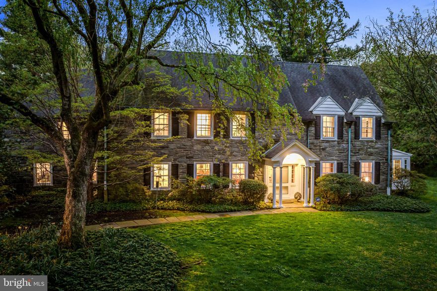 Welcome to this North-side Bryn Mawr gem, set on a beautiful .87 acre lot within walking distance to renowned schools, parks, shopping, trains, and the charming town of Bryn Mawr. Built in 1924, this sun-filled all stone home with plaster walls, deep set windows and charming architectural details, features beautiful original oak floors throughout, original millwork and moldings, gracious front to back foyer with spacious living room, dining room, cozy library, kitchen with breakfast room and back staircase leading up to the secondary bedrooms, easily expandable primary suite, adjacent to a second large bedroom,  4 additional bedrooms with 2 full baths on the second floor and a walk up third floor with bonus room.   It offers wonderful views out every window of the private grounds and walkable neighborhood with beautiful specimen plantings, has been lovingly maintained with incredible bones and awaits its new owners to create the home of their dreams.  A rare find that will not last long! 
*Underground oil tank is being removed and replaced with a new oil tank to be located in the basement by 5/16. Natural gas may also easily be brought in from the street.*