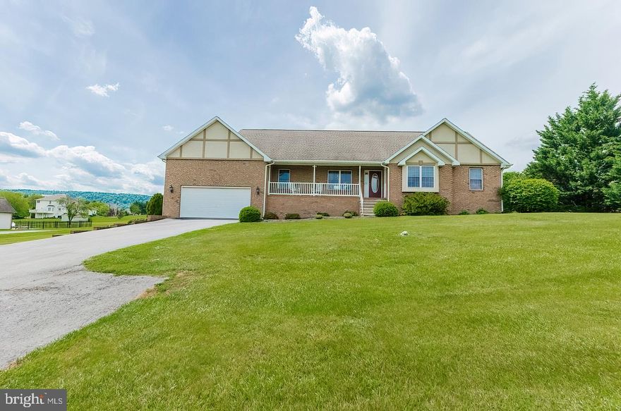Beautifully maintained rambler on almost an acre of land. The moment you walk in you will feel the spaciousness of this lovely home with vaulted ceiling and gorgeous wall of windows that looks out over the back lawn. The primary bedroom also has a vaulted ceiling and large bath with soaking tub and separate shower. The inviting outdoor living space is ready for you to make it your own, from the covered deck off the dining area to the paver patio on the lower level, you will have plenty of space to entertain. The lower level consists of two large finished areas, a roomy unfinished area for storage,  French doors to the patio area, and a full bath. Public Water with Private Septic.