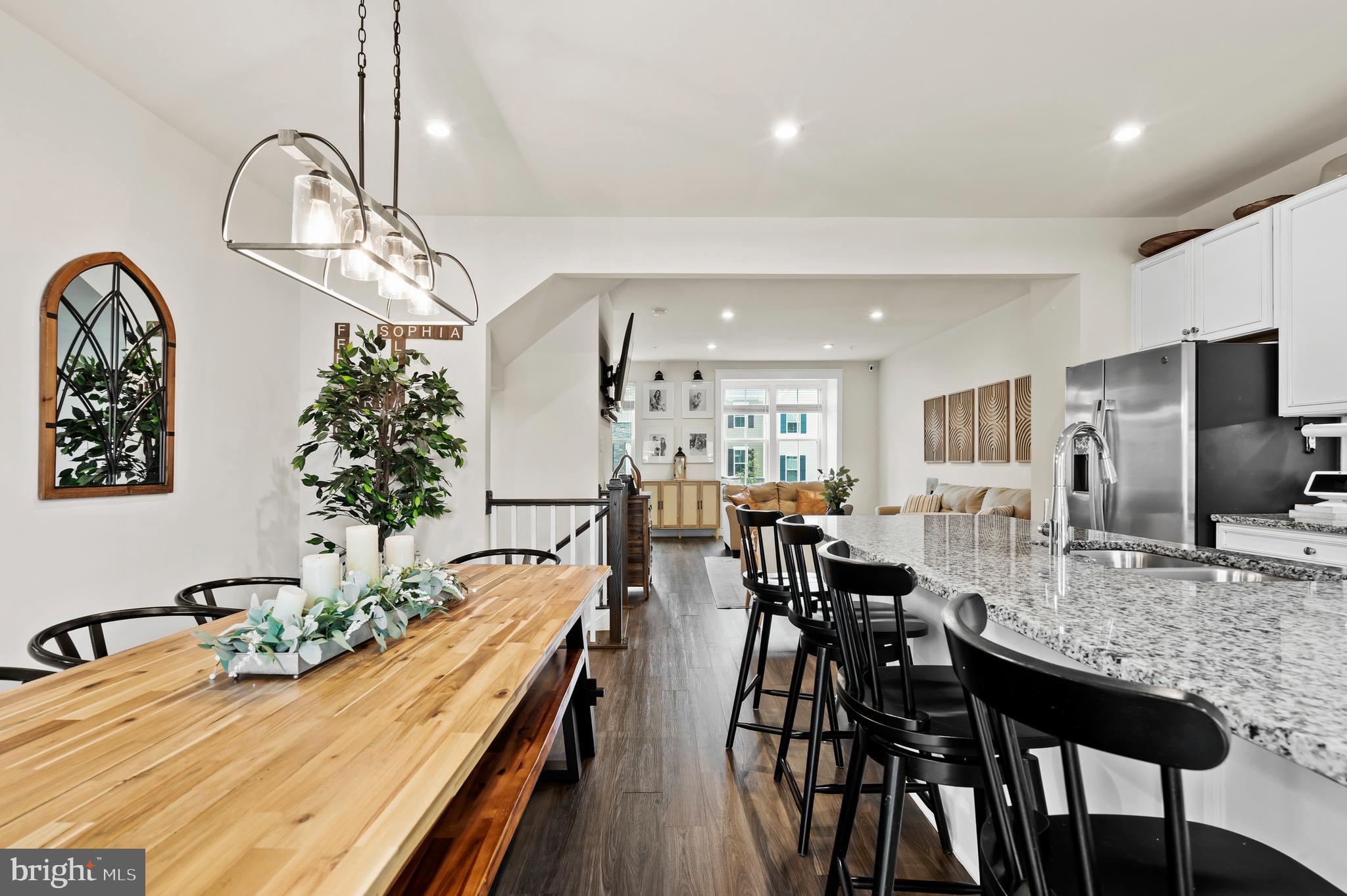 OPEN HOUSE SUNDAY 7/3 12-2PM Welcome to 294 Sugar Maple Square – A Thoughtfully Upgraded, Stylish Retreat in the Heart of Downingtown!
Step inside this beautifully upgraded Mozart model townhome, where thoughtful custom touches and modern finishes elevate every corner. The entry-level foyer features durable upgraded LVP flooring and a custom picture moulding accent wall, setting a warm and sophisticated tone. Just off the foyer, a spacious flex room—complete with French doors—is currently used as a multifunctional guest room, office, and creative space. You’ll also find a large pantry/storage closet, a coat closet, the utility room, and access to the finished and painted 2-car garage with built-in storage cabinets.
Ascend the oak stairs with upgraded treads to the sun-soaked second floor, where a wide open layout makes everyday living and entertaining a breeze. The designer kitchen is the heart of the home, showcasing Kinsdale painted pewter cabinets, upgraded granite countertops, a subway tile backsplash, under-cabinet lighting, and an oversized island with decorative moulding. Stainless steel appliances and a gas stove round out the chef-worthy kitchen.
The adjacent dining area features ceiling pre-wiring for a chandelier and opens via sliders to a large, low-maintenance composite deck—shaded in the afternoons for cool summer lounging, grilling, or sipping cocktails. The inviting living room offers a custom built-in bench in the cozy bay window nook providing additional storage and elegant moulding throughout, plus a hidden TV pre-wire setup and LED lighting throughout for effortless ambiance. A beautifully designed powder room completes this floor.
Upstairs, the spacious primary suite includes a large walk-in closet with custom shelving and an en-suite bath with a dual vanity and upgraded tile shower. Two additional bedrooms are bathed in natural light and feature charming accent walls and upgraded closet systems. The hall bath and laundry room have both been upgraded with stylish fixtures, lighting, and added cabinetry.
Additional highlights include faux wood blinds throughout, smart locks on the front door, and a Wi-Fi enabled garage door opener.
The sellers plan to leave a lot of the main floor furniture and storage items. Everything is negotiable.